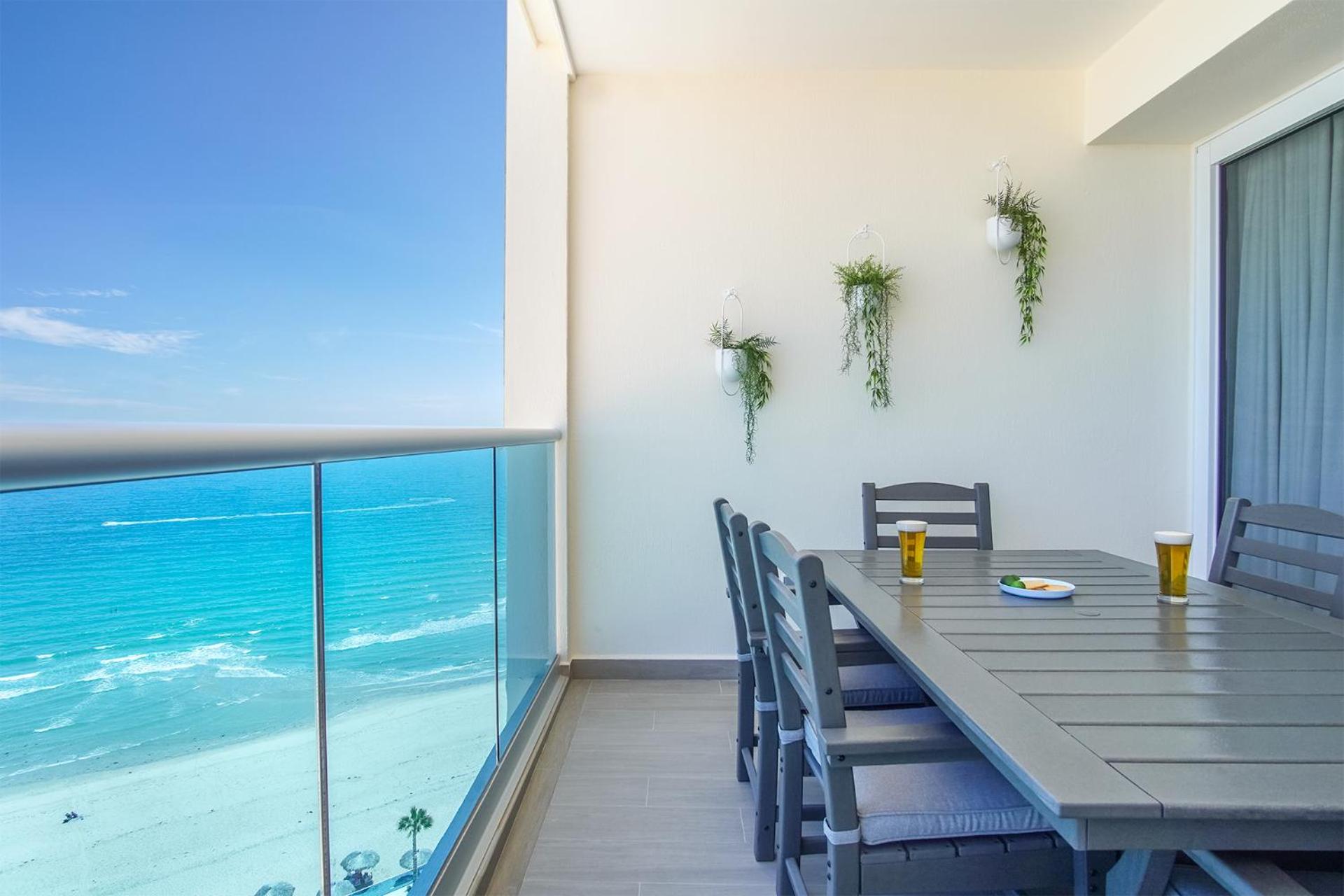 Relax in this modern ocean front condo Encantame E1404