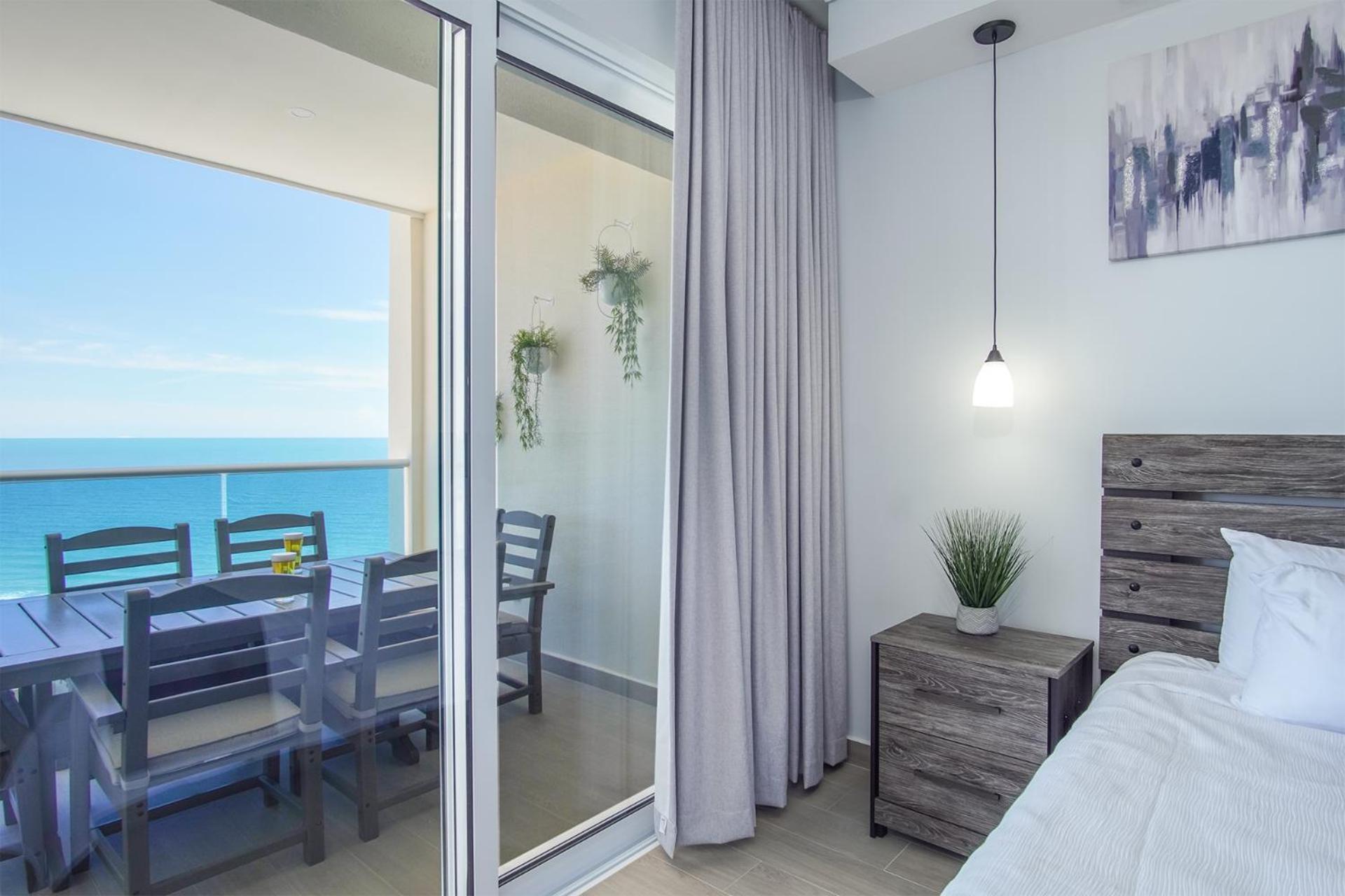Relax in this modern ocean front condo Encantame E1404