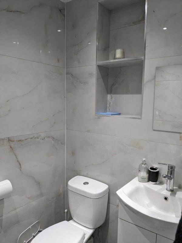 Private guest suite inside a family home with own entrance, kitchen, and bathroom