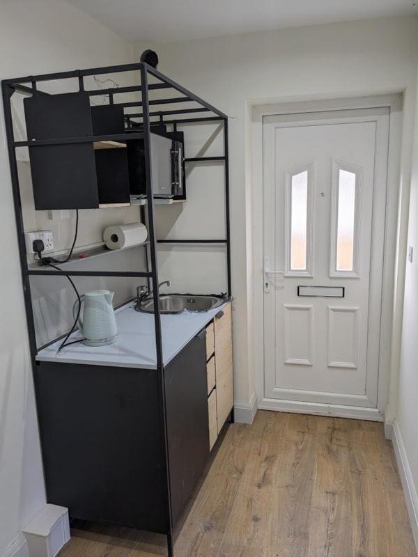 Private guest suite inside a family home with own entrance, kitchen, and bathroom
