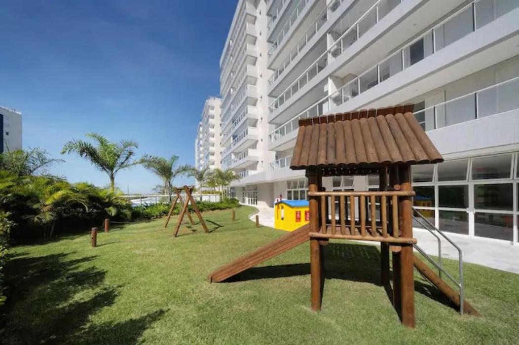 Home 12| Ap piscina aquecida pé na areia Bertioga