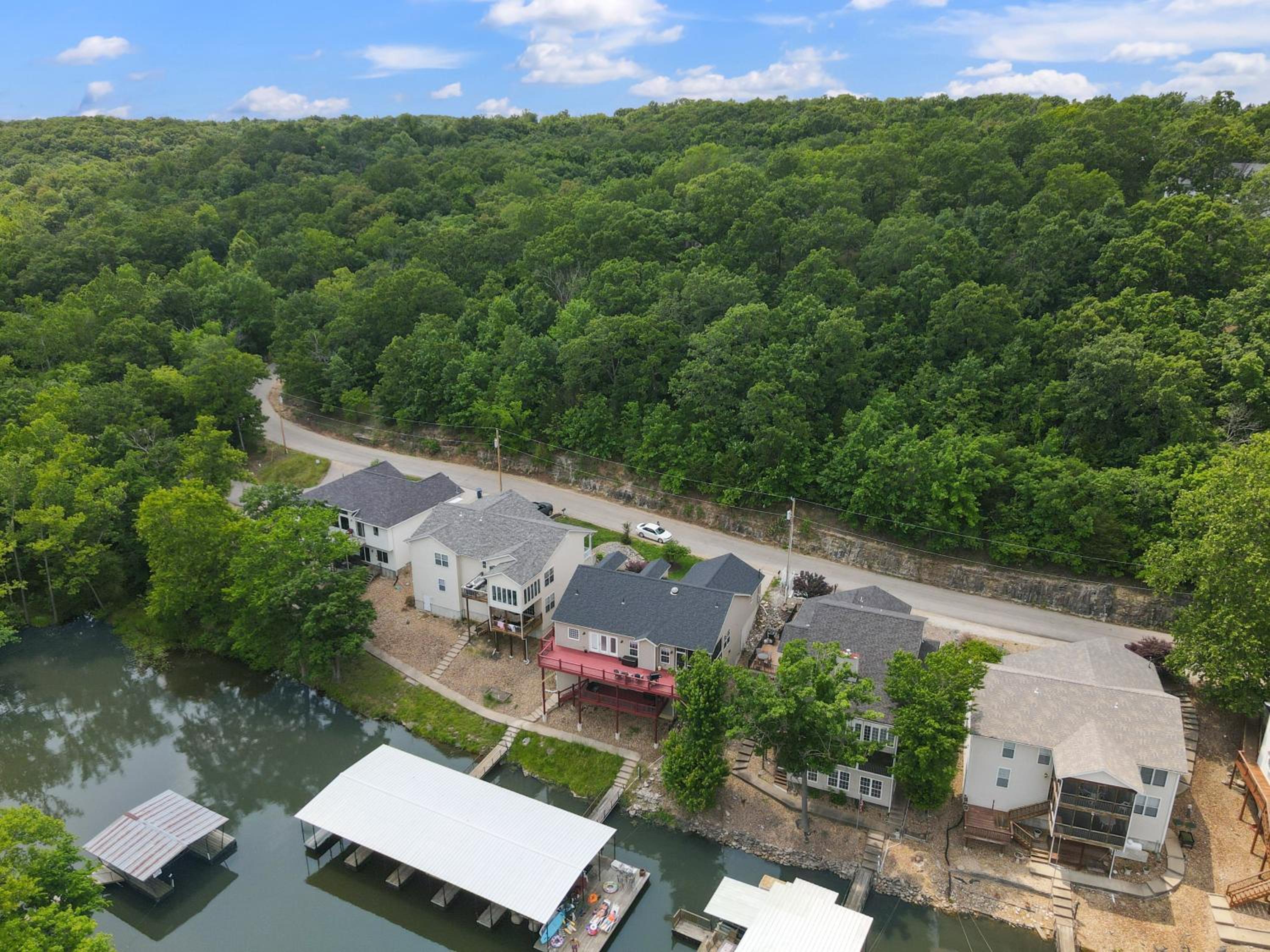 Lux Lakehouse w/ 2 Living Areas, Screened Porch & Dock Access at 22MM