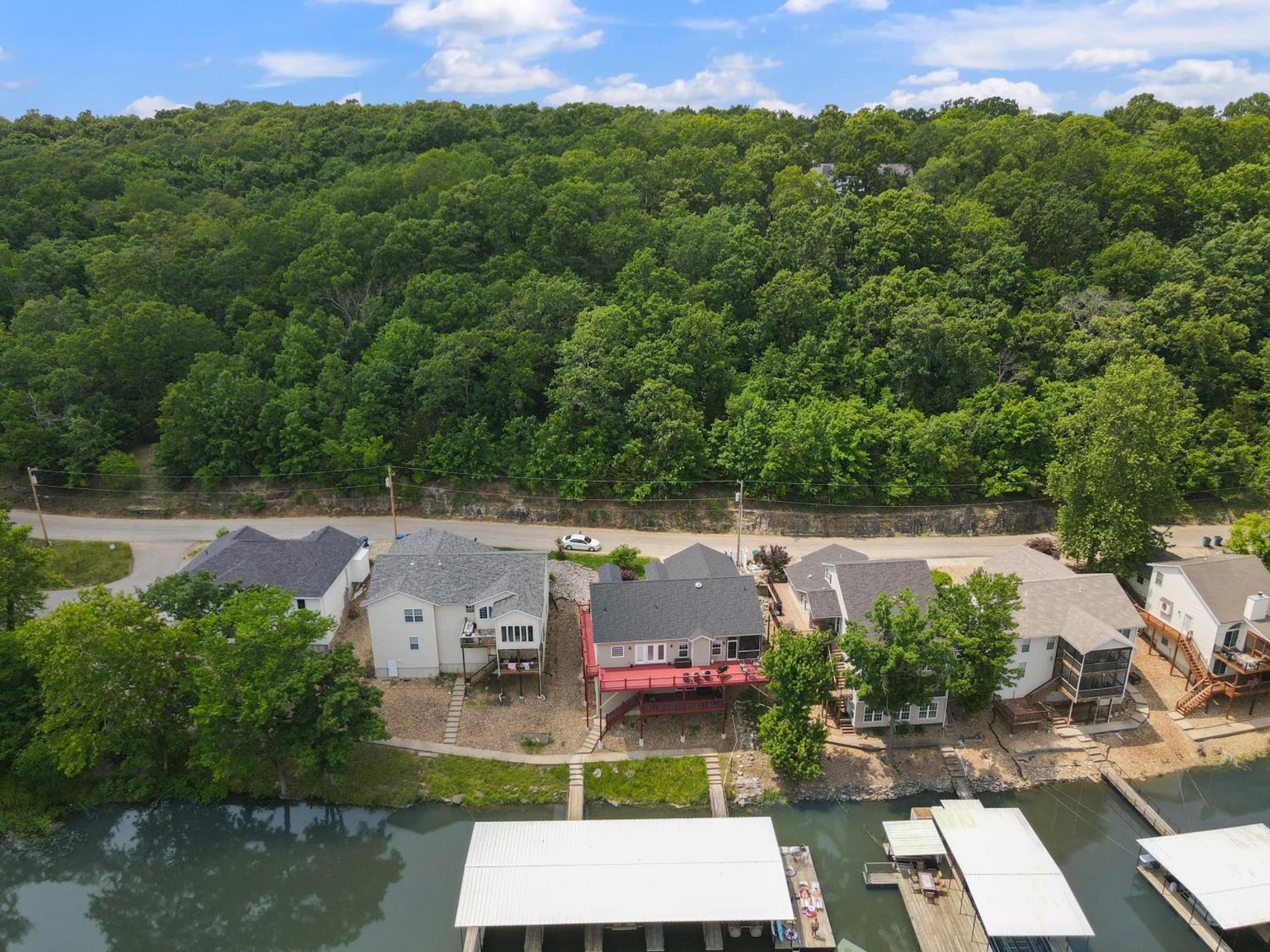 Lux Lakehouse w/ 2 Living Areas, Screened Porch & Dock Access at 22MM
