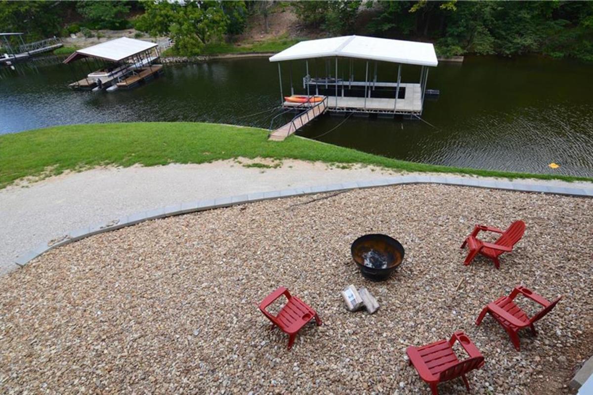 Newly Updated in a Private Cove, with Firepit, Flat Lawn, Dock, Boat Slip & Kayaks in Osage Beach