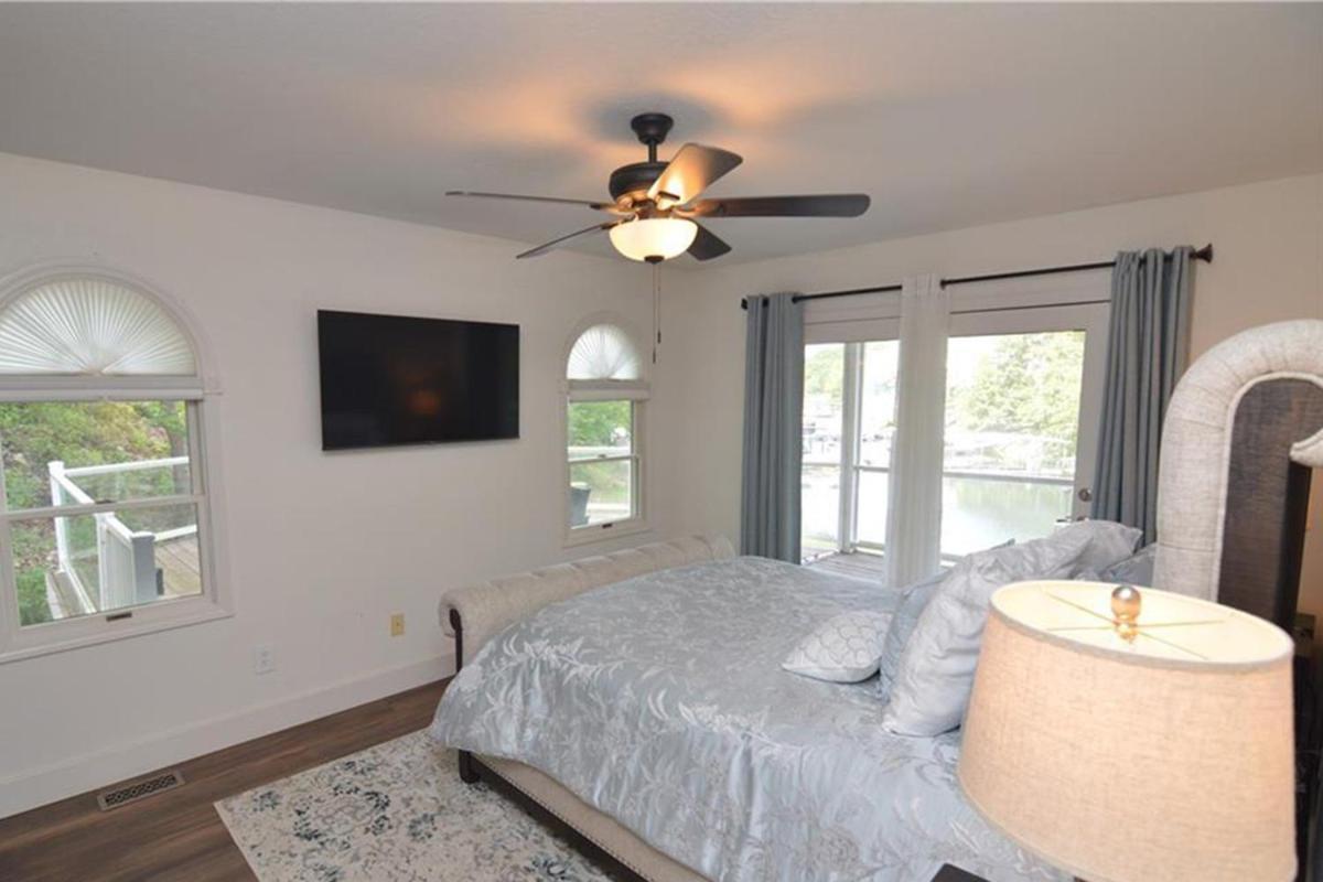 Newly Updated in a Private Cove, with Firepit, Flat Lawn, Dock, Boat Slip & Kayaks in Osage Beach