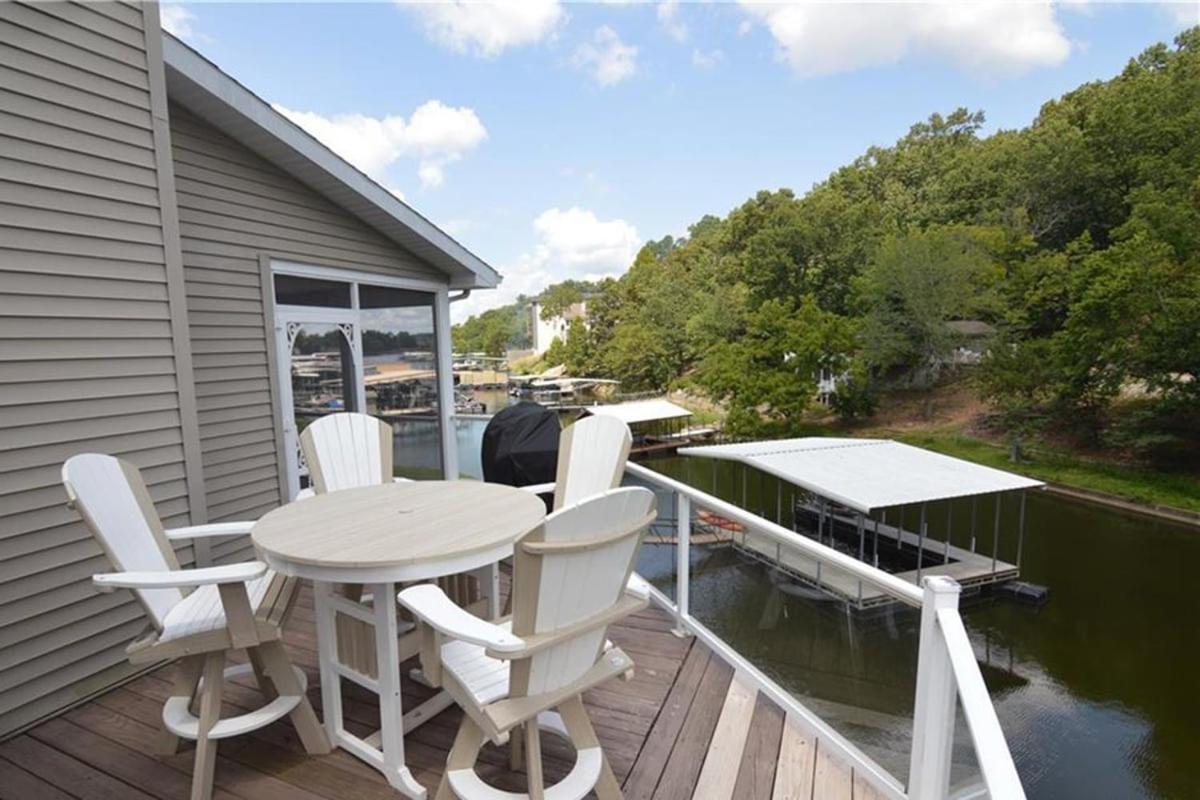Newly Updated in a Private Cove, with Firepit, Flat Lawn, Dock, Boat Slip & Kayaks in Osage Beach