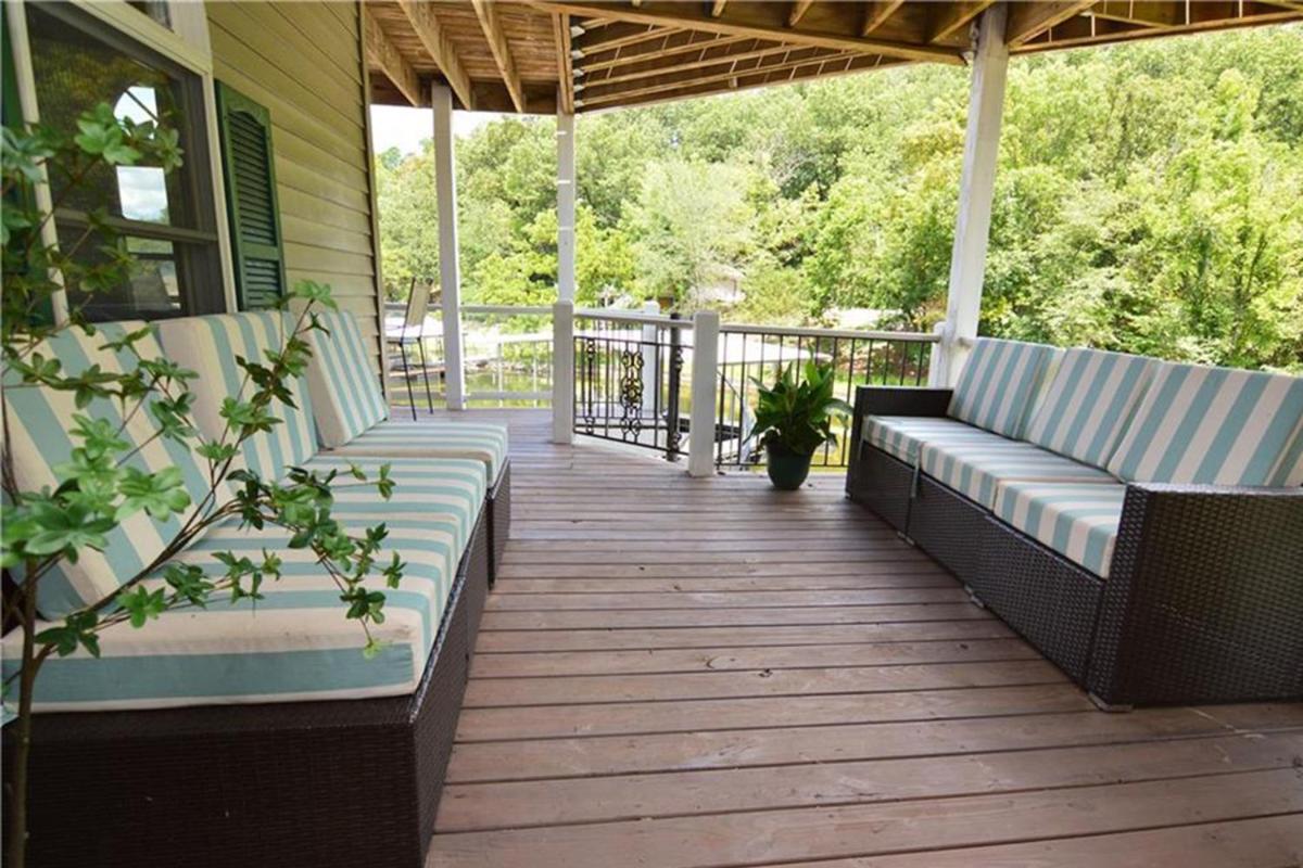 Newly Updated in a Private Cove, with Firepit, Flat Lawn, Dock, Boat Slip & Kayaks in Osage Beach