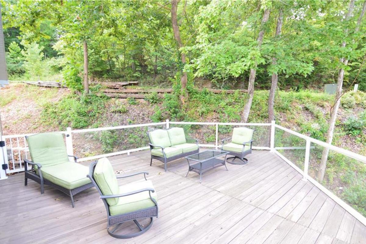 Newly Updated in a Private Cove, with Firepit, Flat Lawn, Dock, Boat Slip & Kayaks in Osage Beach