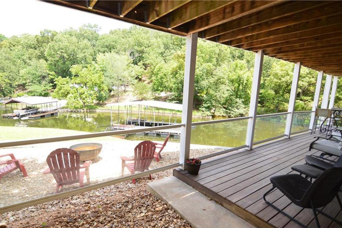 Newly Updated in a Private Cove, with Firepit, Flat Lawn, Dock, Boat Slip & Kayaks in Osage Beach