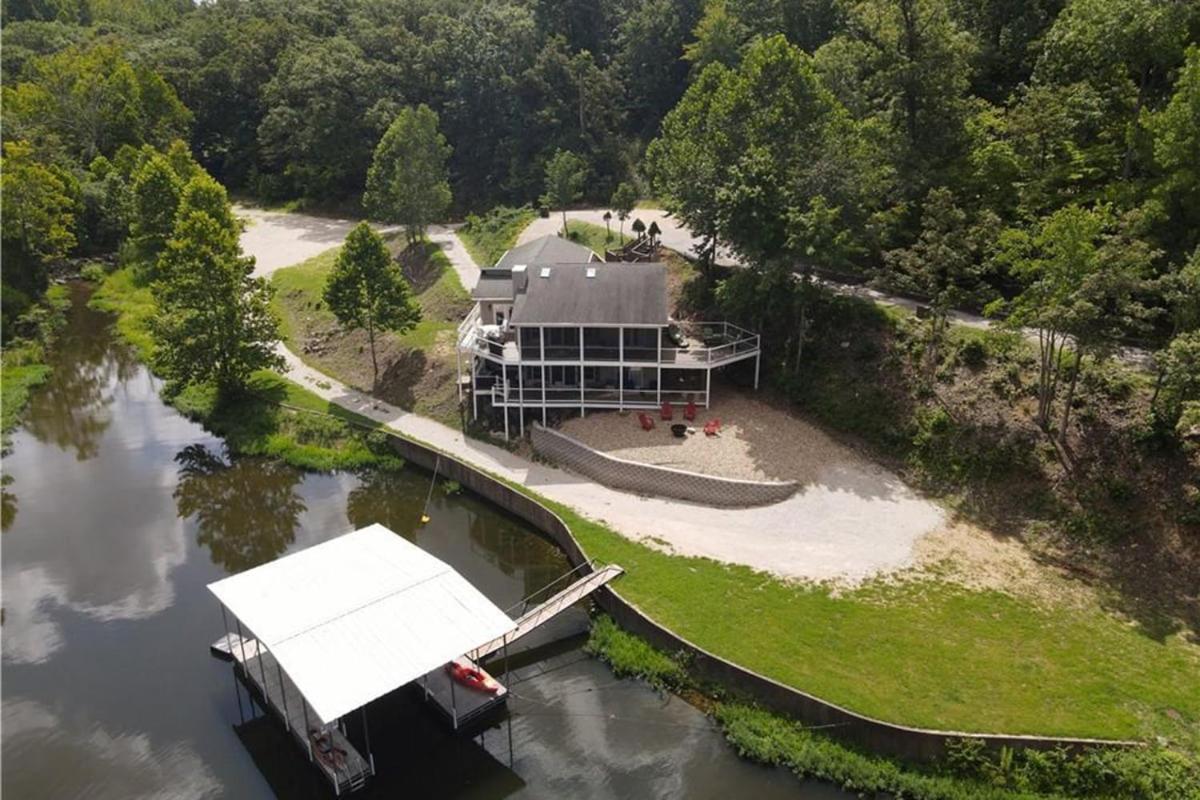 Newly Updated in a Private Cove, with Firepit, Flat Lawn, Dock, Boat Slip & Kayaks in Osage Beach