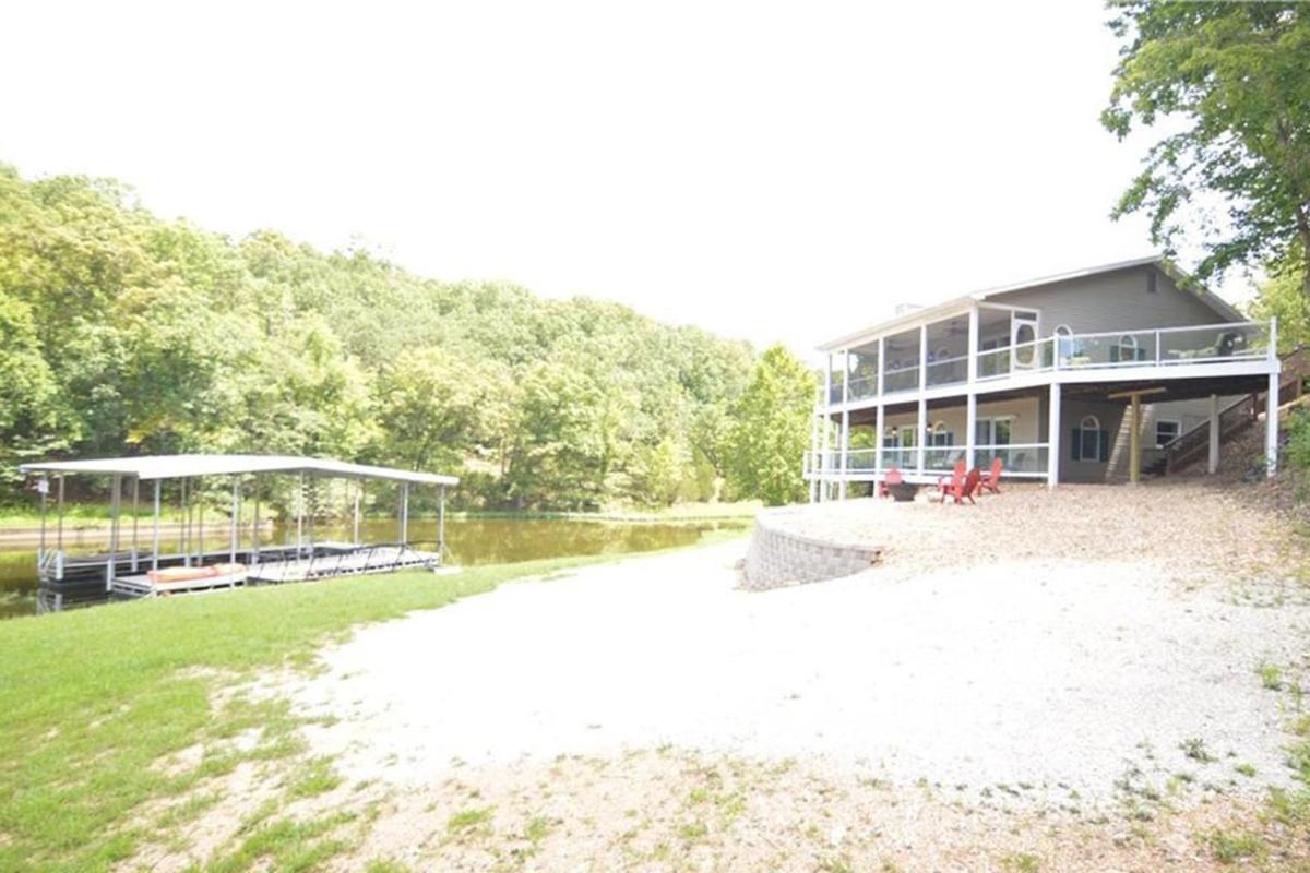 Newly Updated in a Private Cove, with Firepit, Flat Lawn, Dock, Boat Slip & Kayaks in Osage Beach