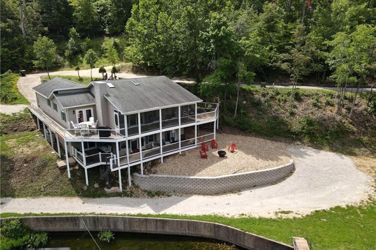 Newly Updated in a Private Cove, with Firepit, Flat Lawn, Dock, Boat Slip & Kayaks in Osage Beach