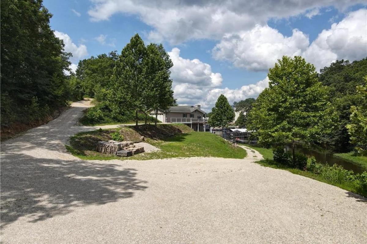 Newly Updated in a Private Cove, with Firepit, Flat Lawn, Dock, Boat Slip & Kayaks in Osage Beach
