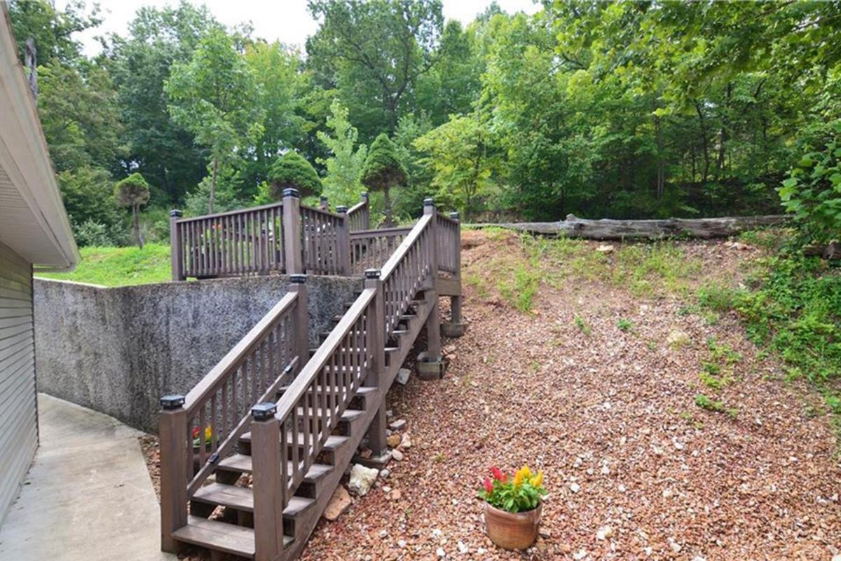 Newly Updated in a Private Cove, with Firepit, Flat Lawn, Dock, Boat Slip & Kayaks in Osage Beach