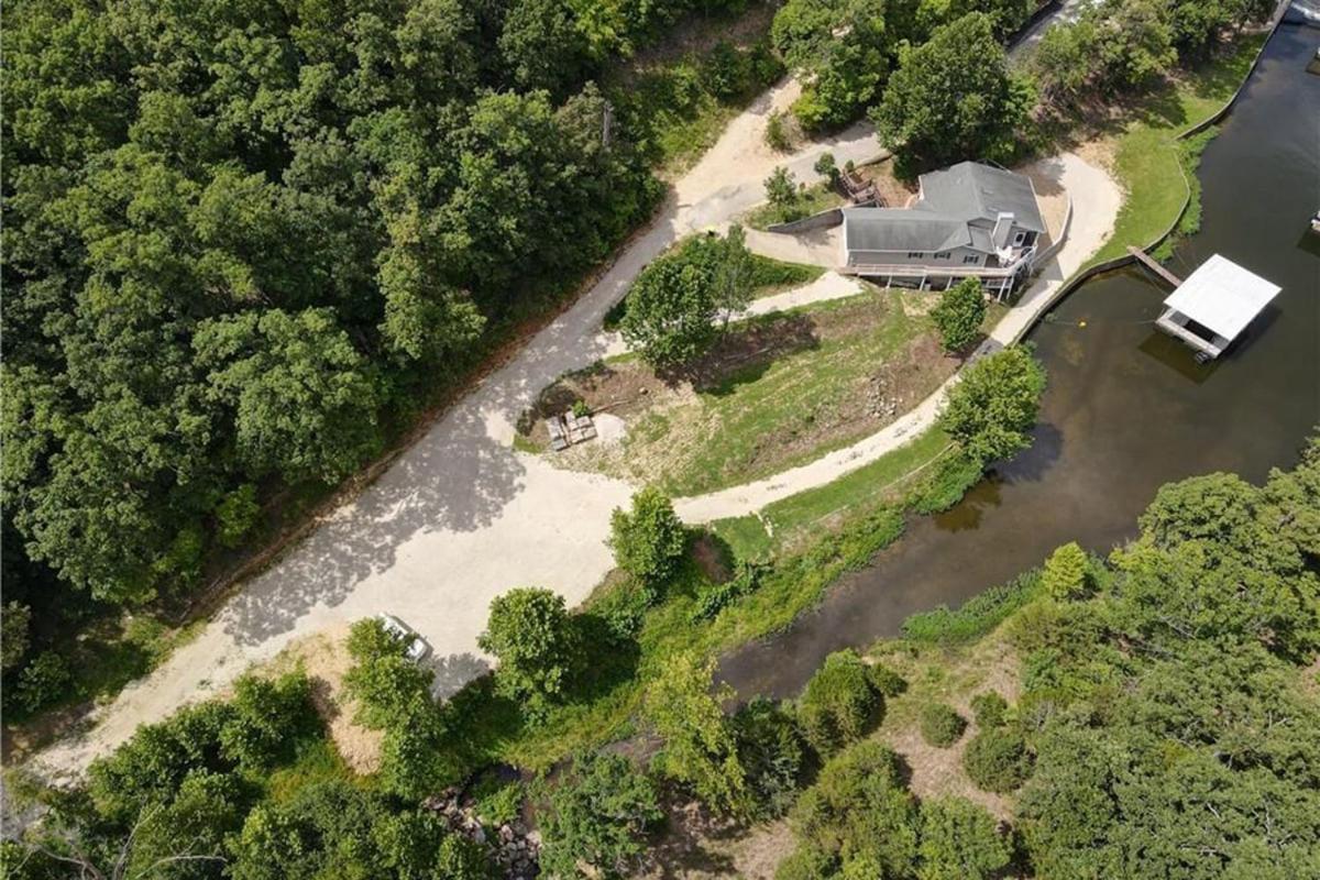 Newly Updated in a Private Cove, with Firepit, Flat Lawn, Dock, Boat Slip & Kayaks in Osage Beach
