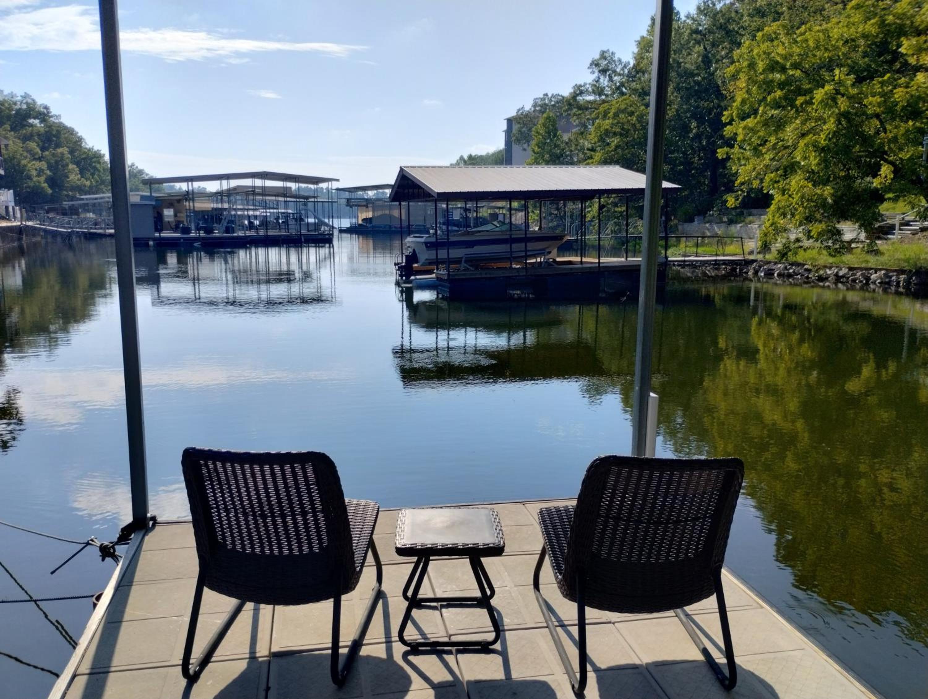 Newly Updated in a Private Cove, with Firepit, Flat Lawn, Dock, Boat Slip & Kayaks in Osage Beach