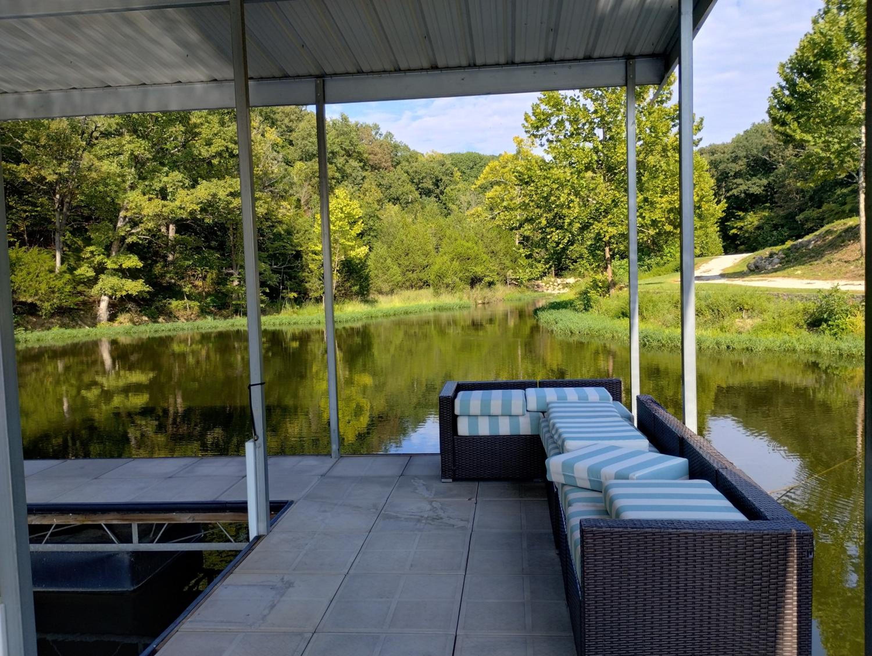 Newly Updated in a Private Cove, with Firepit, Flat Lawn, Dock, Boat Slip & Kayaks in Osage Beach