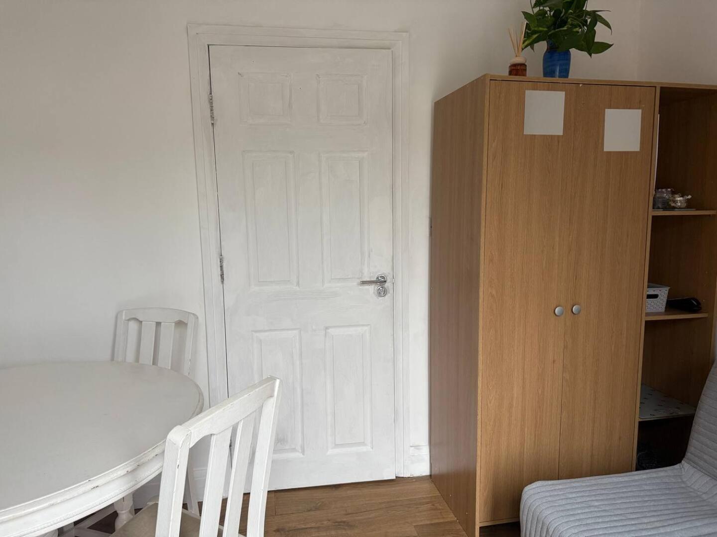 Private guest suite inside a family home with own entrance, kitchen, and bathroom