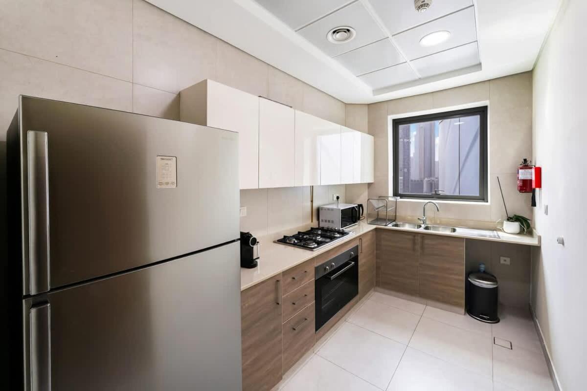 FAM Living - 2BR Apartment with Burj & Canal Views at The Bay