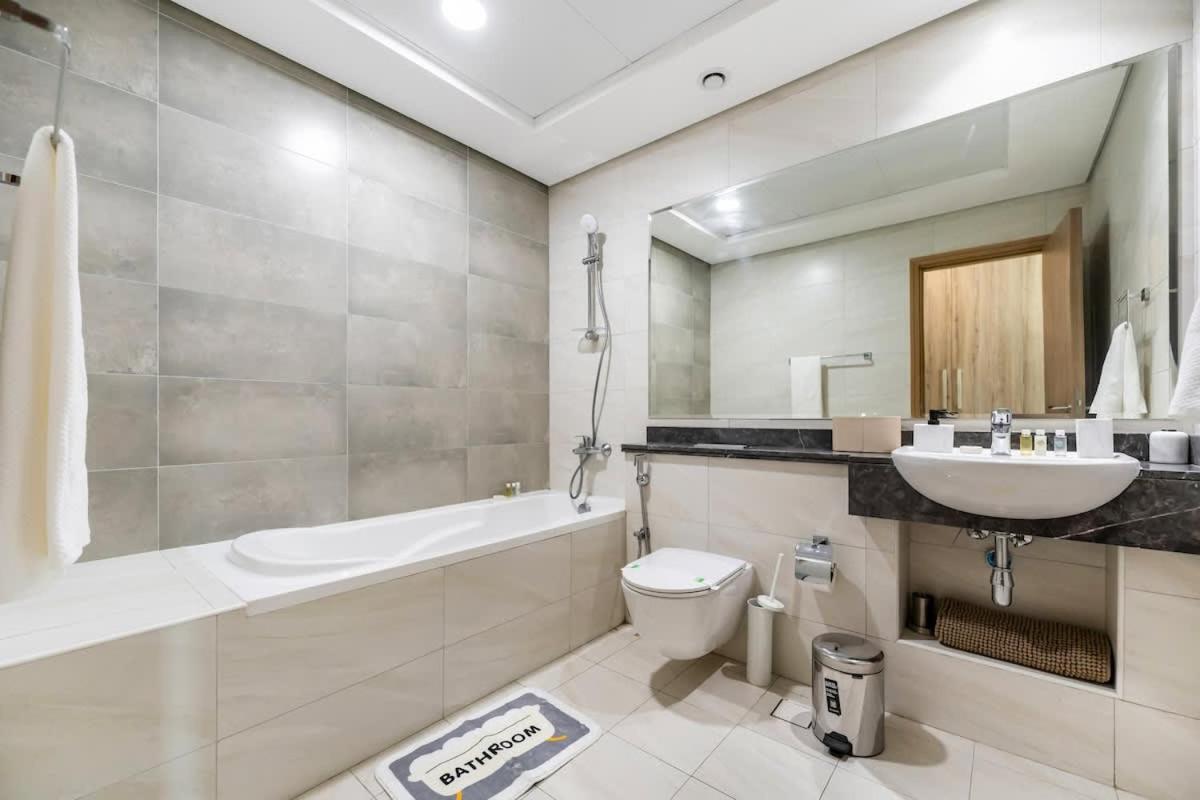 FAM Living - 2BR Apartment with Burj & Canal Views at The Bay