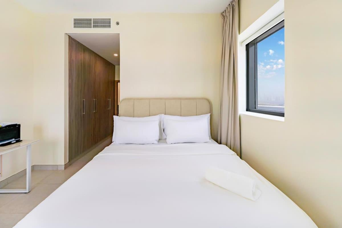 FAM Living - 2BR Apartment with Burj & Canal Views at The Bay