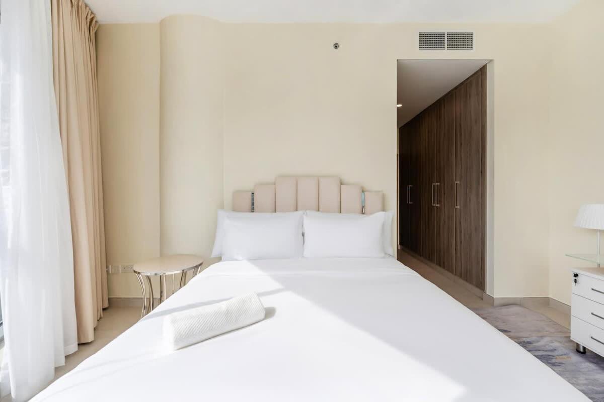 FAM Living - 2BR Apartment with Burj & Canal Views at The Bay