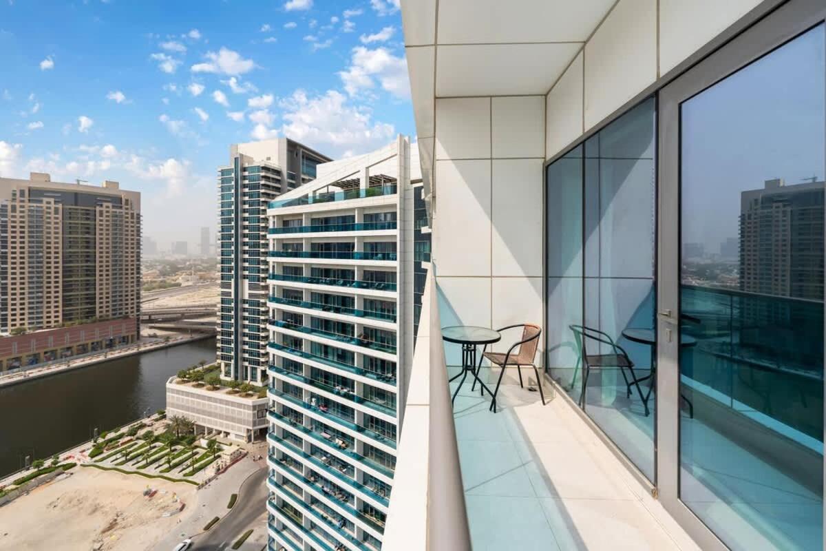 FAM Living - 2BR Apartment with Burj & Canal Views at The Bay