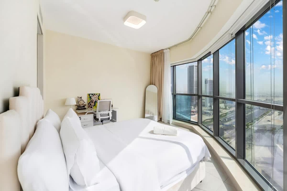 FAM Living - 2BR Apartment with Burj & Canal Views at The Bay