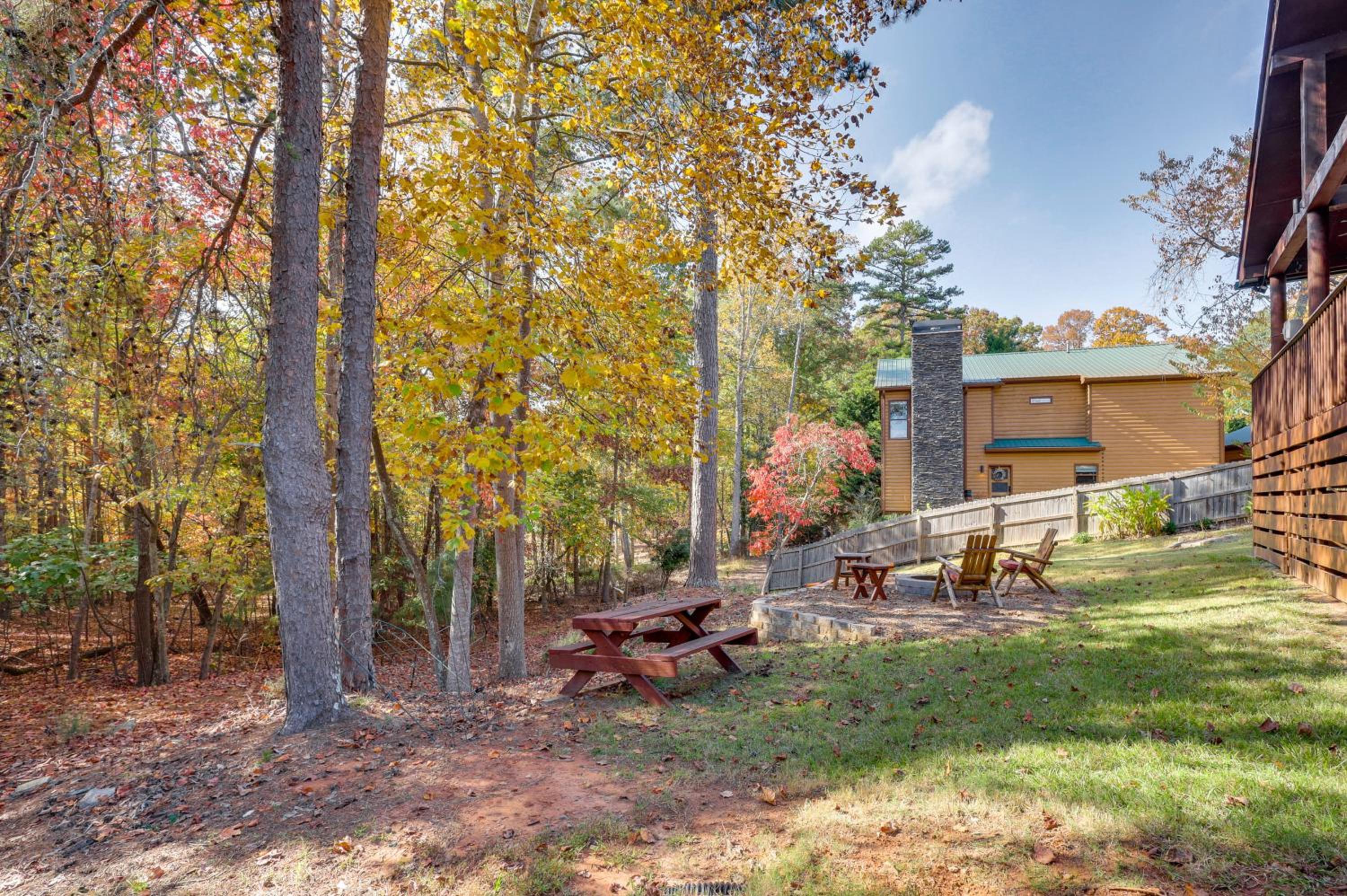 Steps to Lake Lanier Wooded Escape with Boat Dock