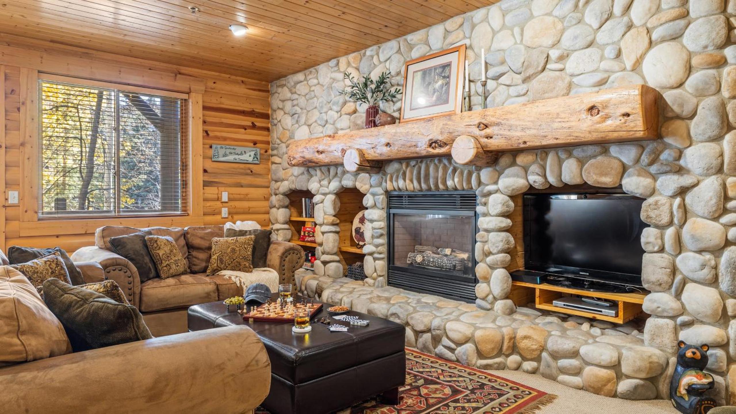 Mountain Charm Stone Fireplace Chefs Kitchen Balcony Cedar Ridge by AvantStay