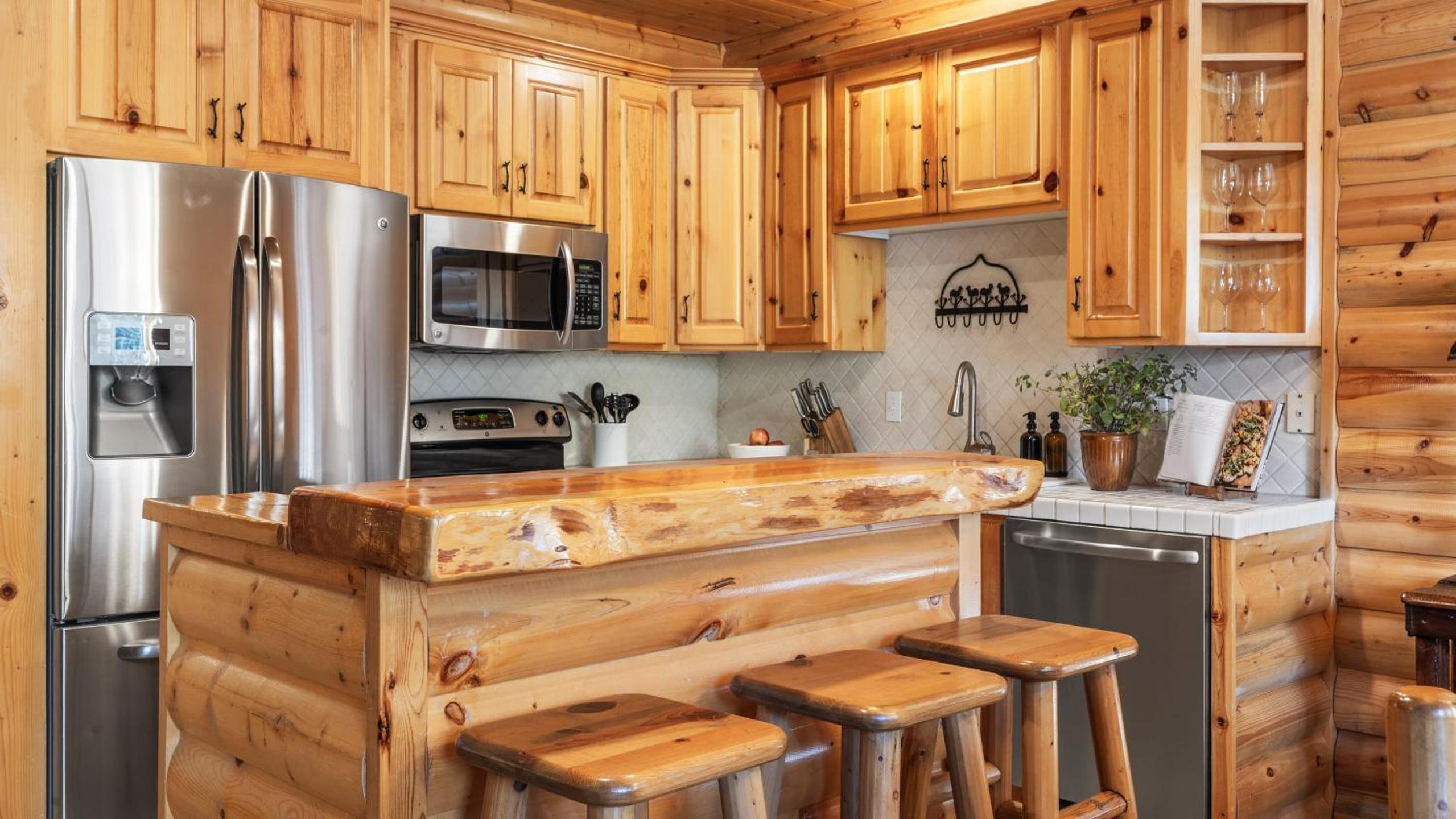 Mountain Charm Stone Fireplace Chefs Kitchen Balcony Cedar Ridge by AvantStay