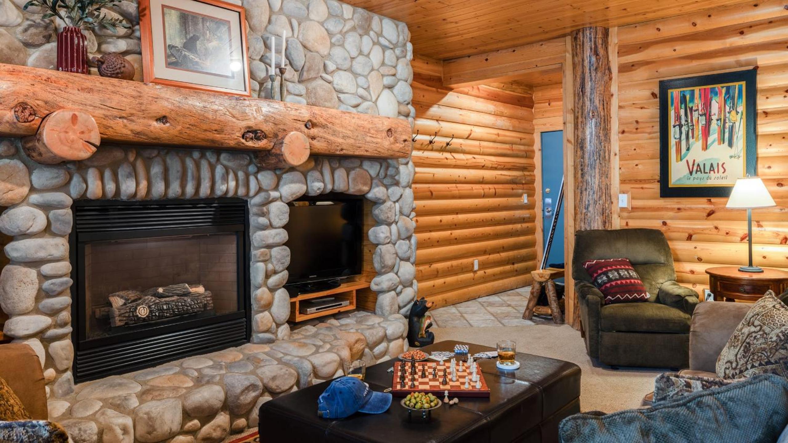 Mountain Charm Stone Fireplace Chefs Kitchen Balcony Cedar Ridge by AvantStay