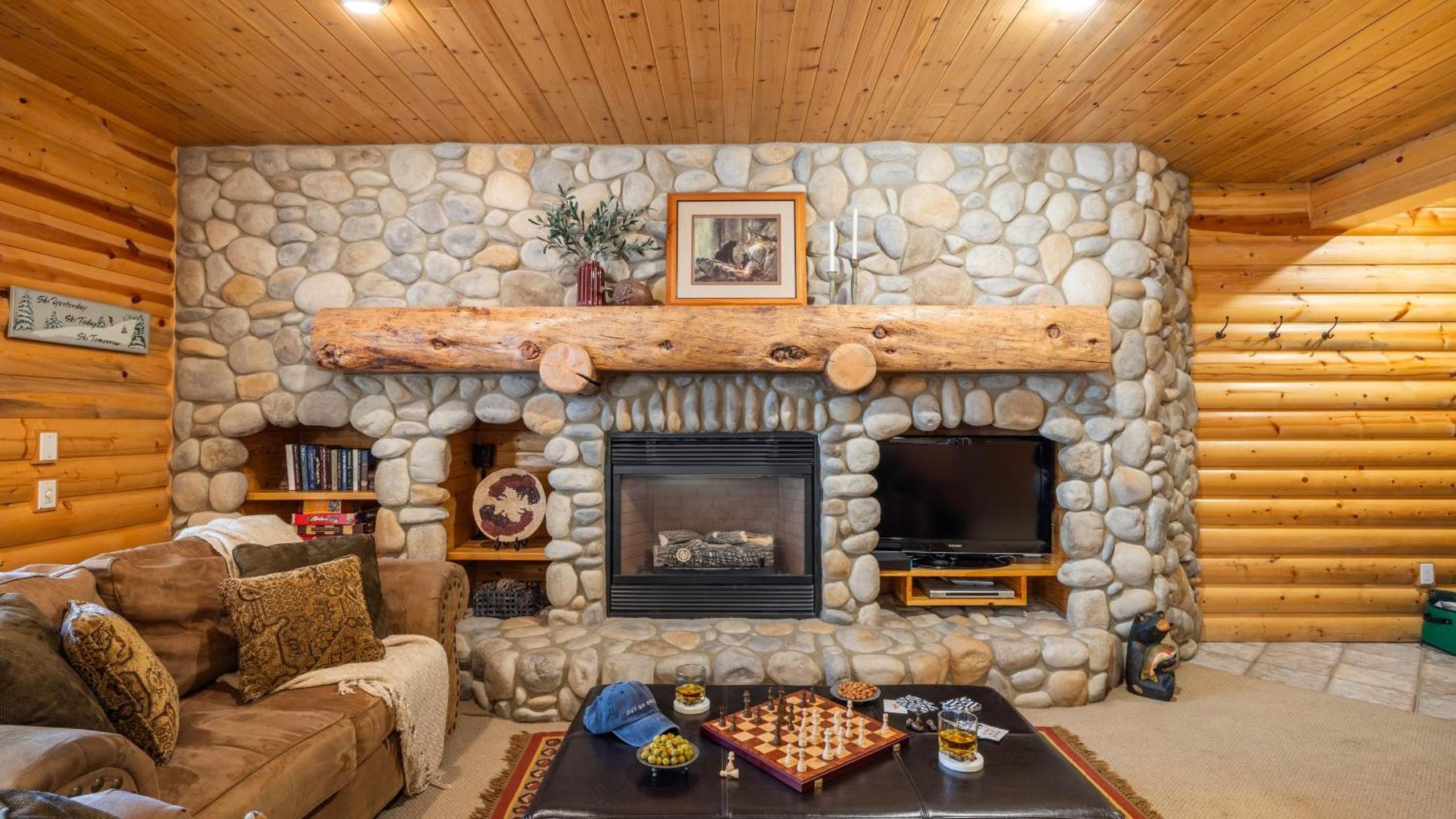 Mountain Charm Stone Fireplace Chefs Kitchen Balcony Cedar Ridge by AvantStay