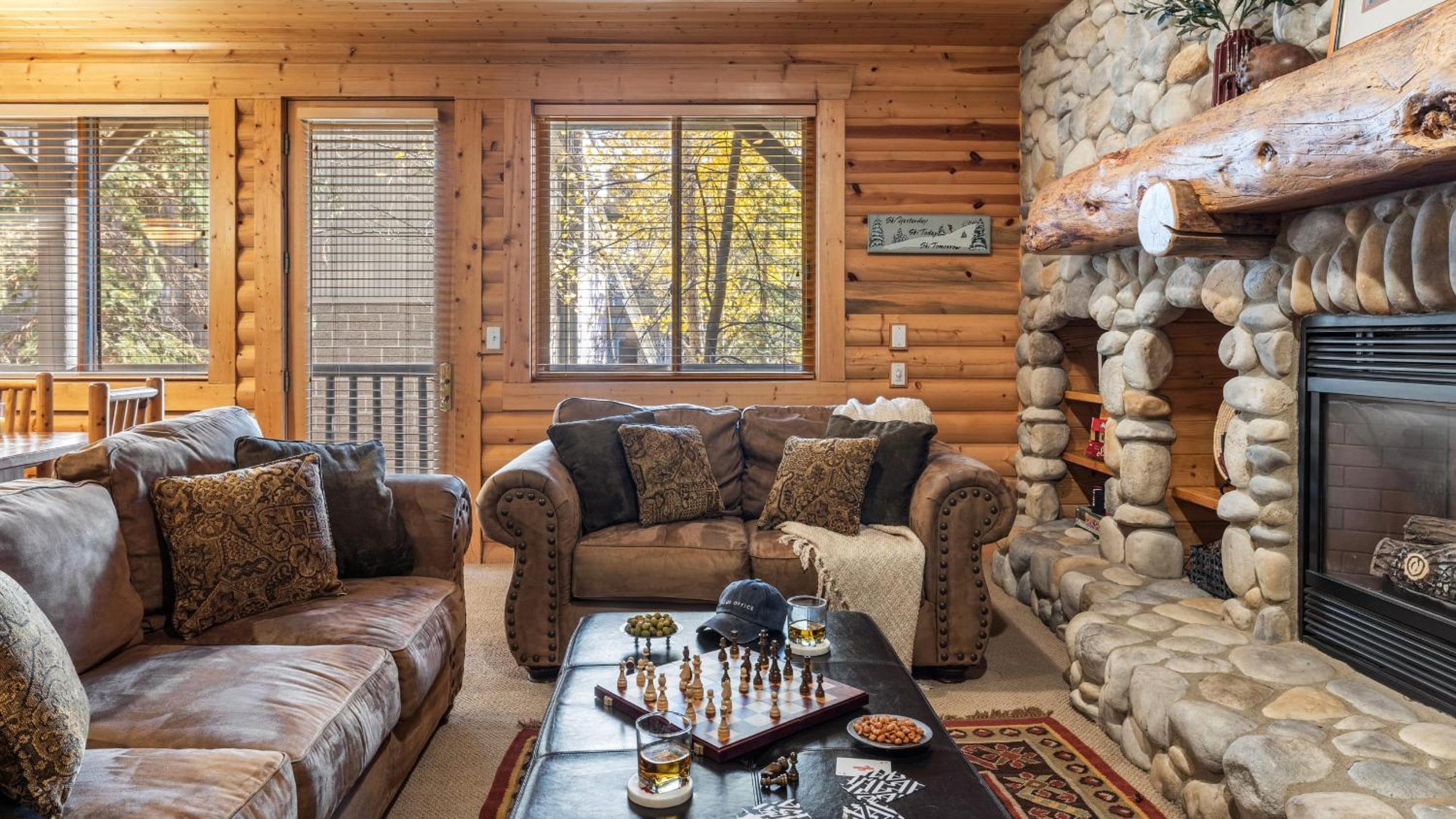 Mountain Charm Stone Fireplace Chefs Kitchen Balcony Cedar Ridge by AvantStay