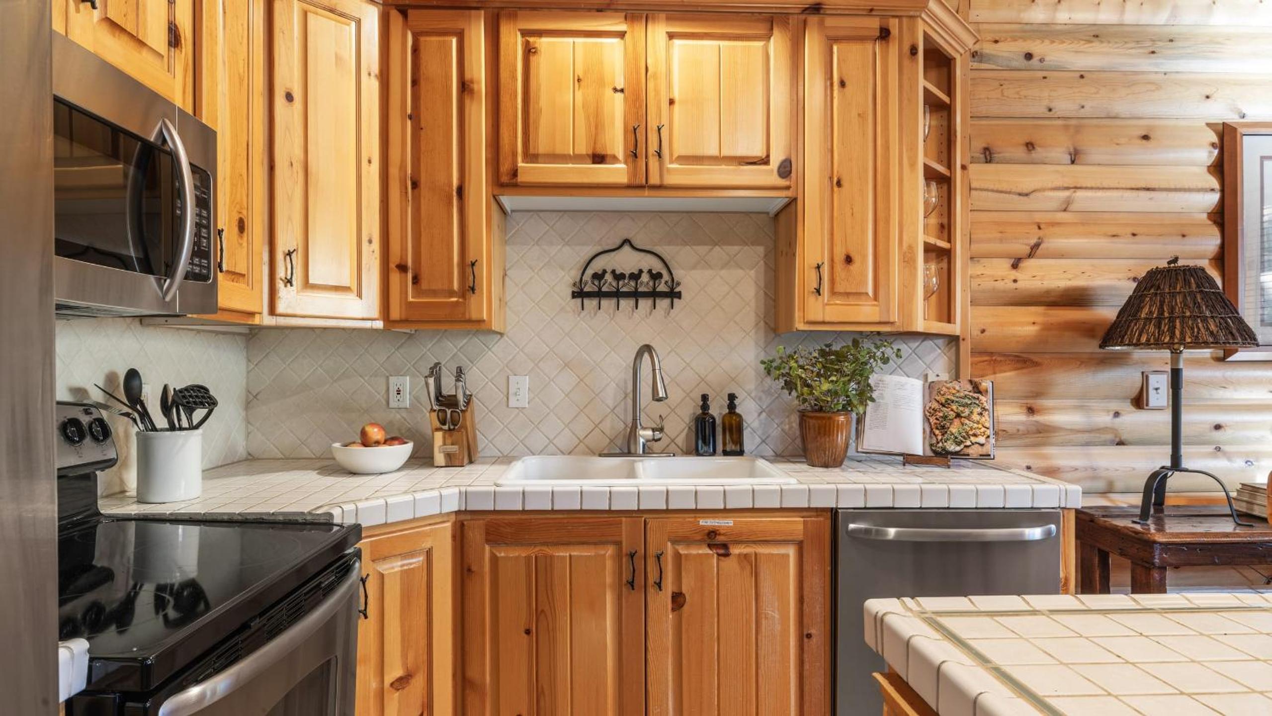 Mountain Charm Stone Fireplace Chefs Kitchen Balcony Cedar Ridge by AvantStay