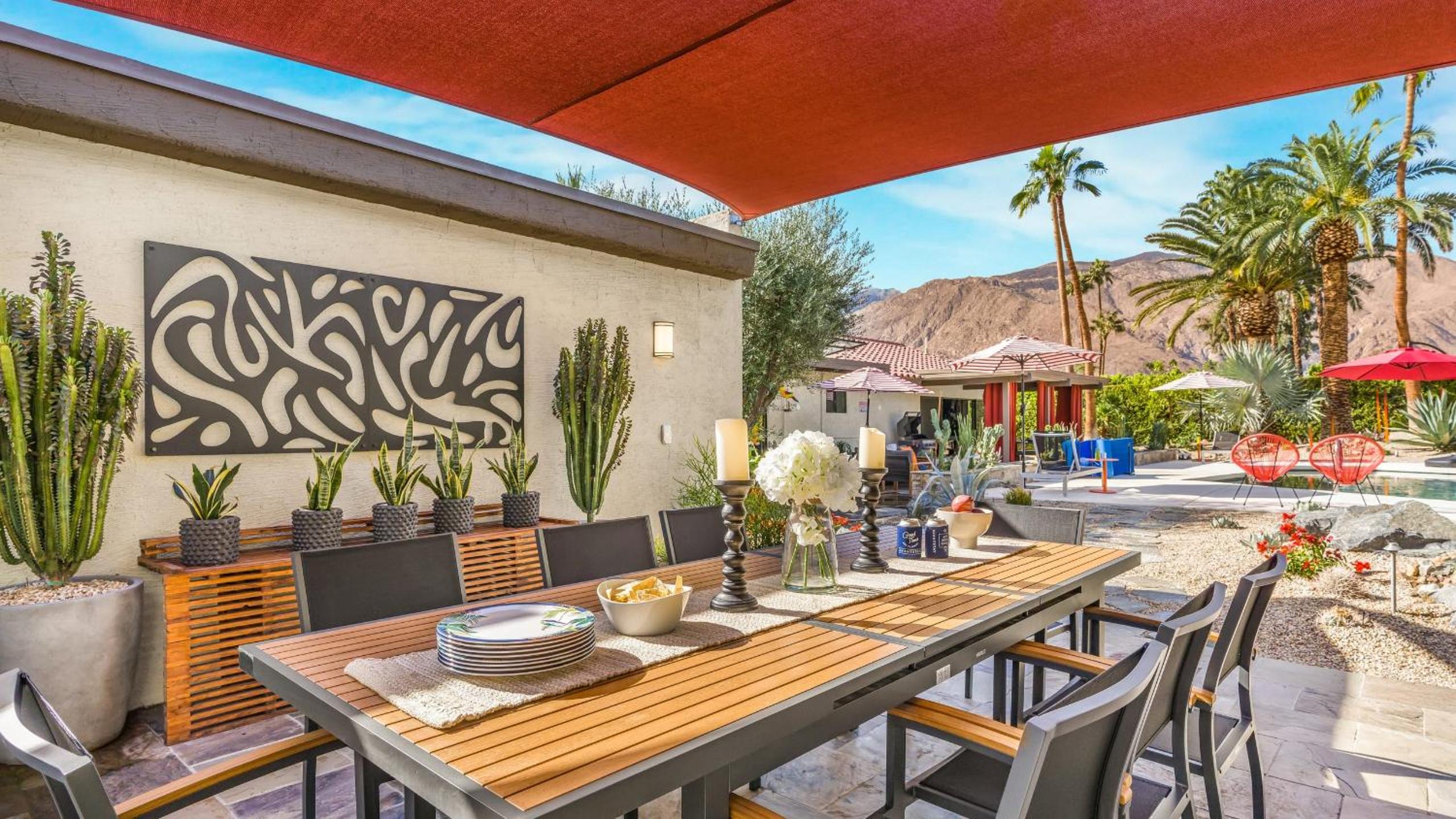 Design-forward Palm Springs home w saltwater pool lush yard multiple outdoor dining areas Casa Papagayo by AvantStay