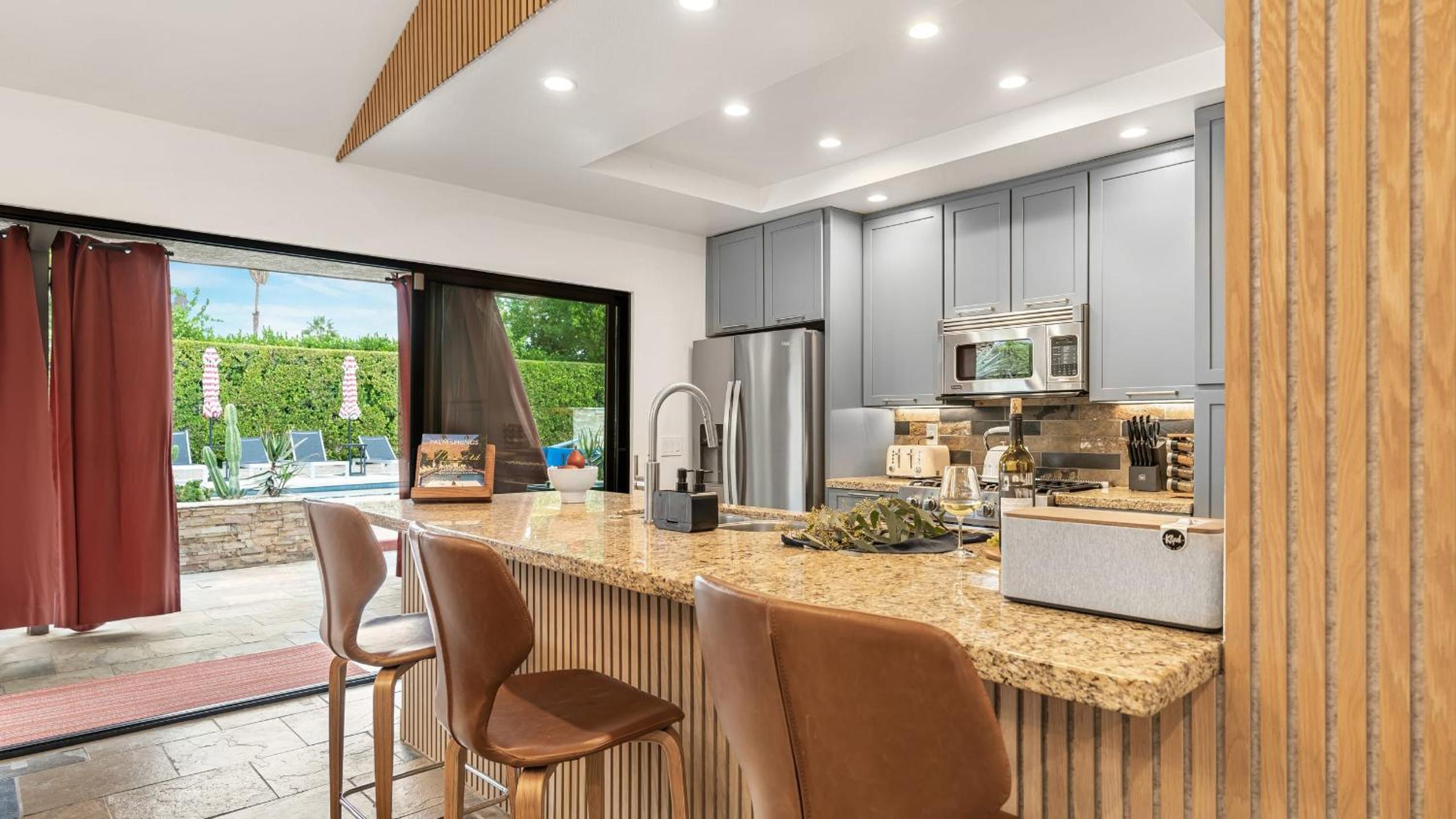 Design-forward Palm Springs home w saltwater pool lush yard multiple outdoor dining areas Casa Papagayo by AvantStay