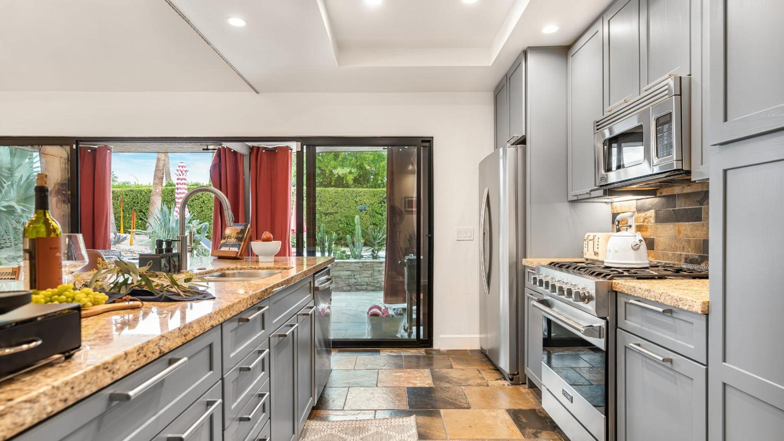 Design-forward Palm Springs home w saltwater pool lush yard multiple outdoor dining areas Casa Papagayo by AvantStay