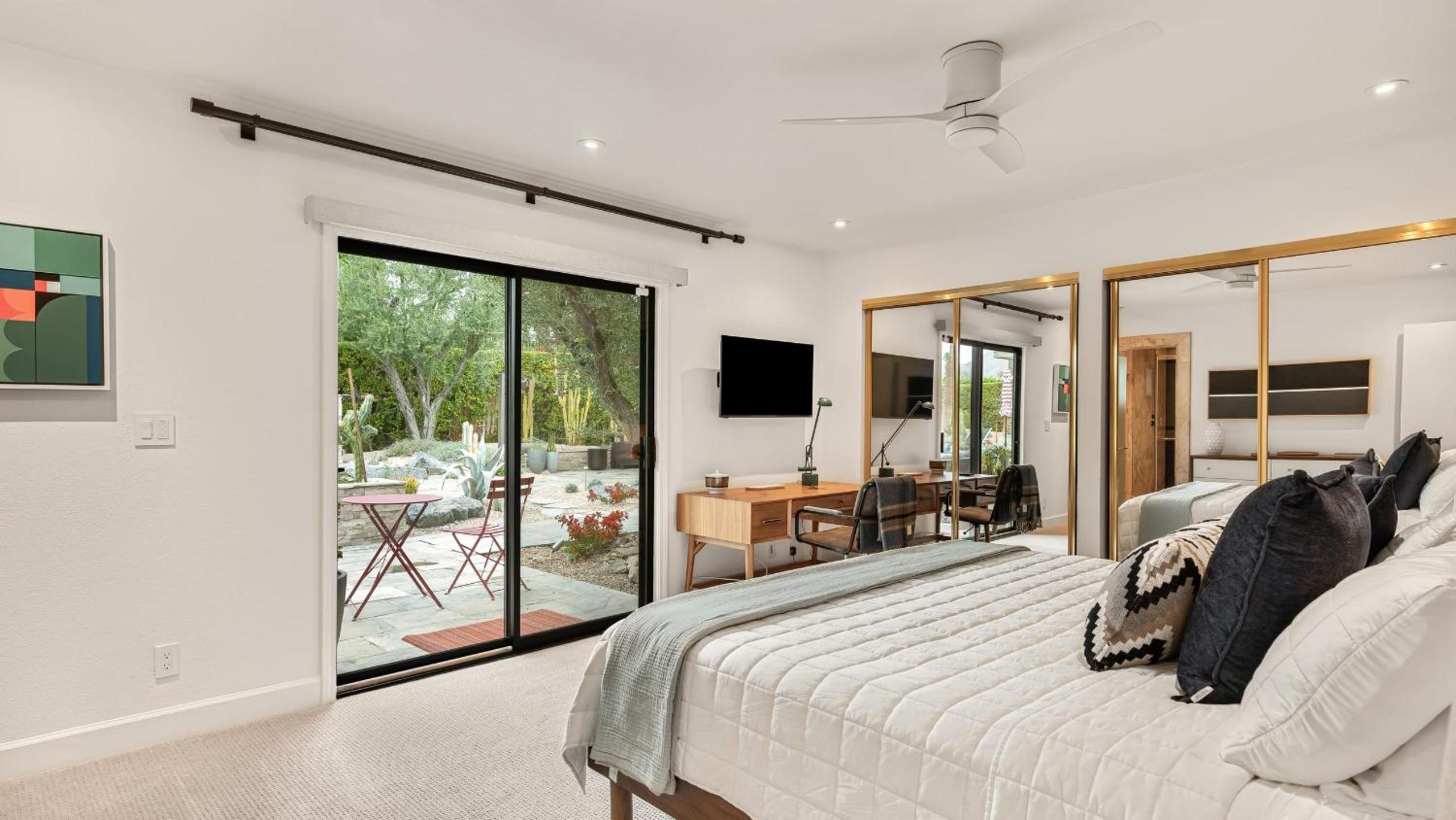 Design-forward Palm Springs home w saltwater pool lush yard multiple outdoor dining areas Casa Papagayo by AvantStay