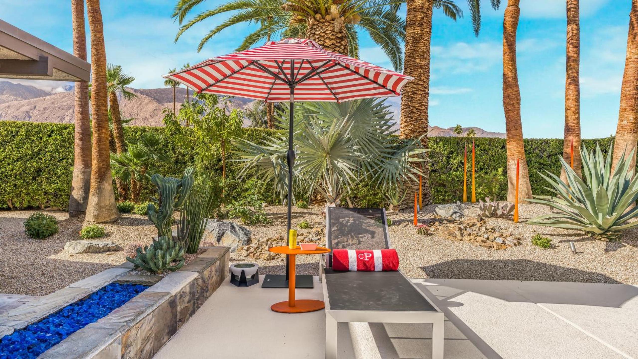 Design-forward Palm Springs home w saltwater pool lush yard multiple outdoor dining areas Casa Papagayo by AvantStay