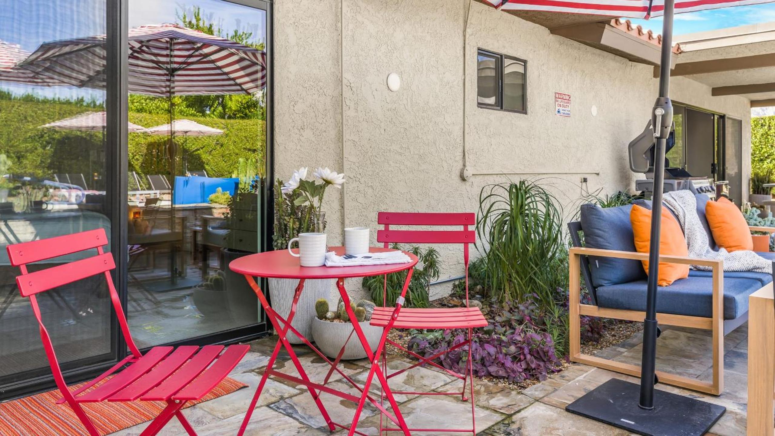 Design-forward Palm Springs home w saltwater pool lush yard multiple outdoor dining areas Casa Papagayo by AvantStay