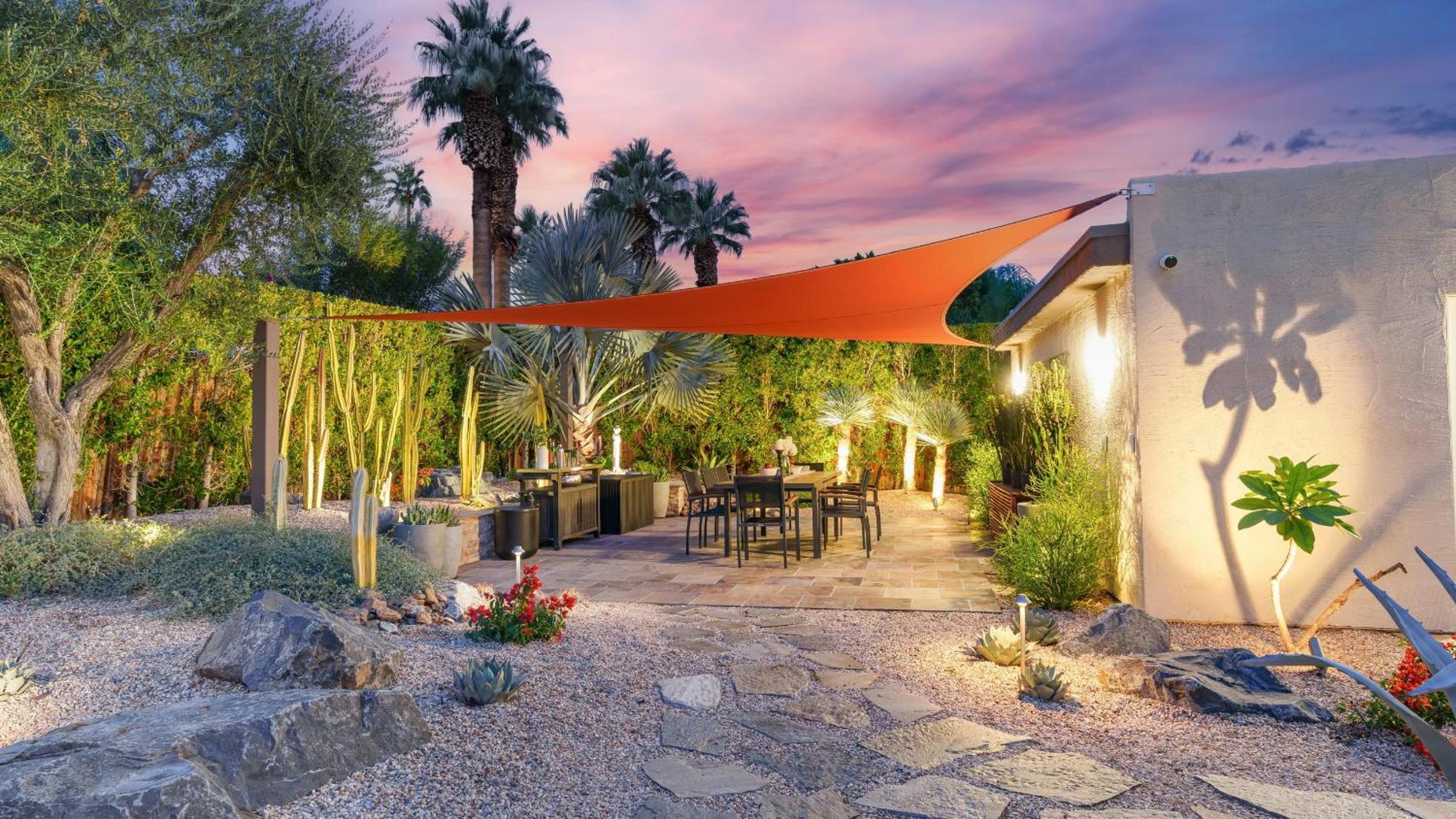 Design-forward Palm Springs home w saltwater pool lush yard multiple outdoor dining areas Casa Papagayo by AvantStay