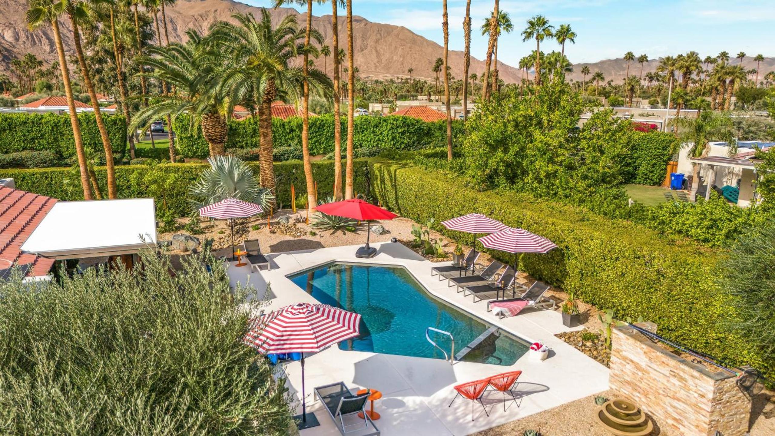 Design-forward Palm Springs home w saltwater pool lush yard multiple outdoor dining areas Casa Papagayo by AvantStay