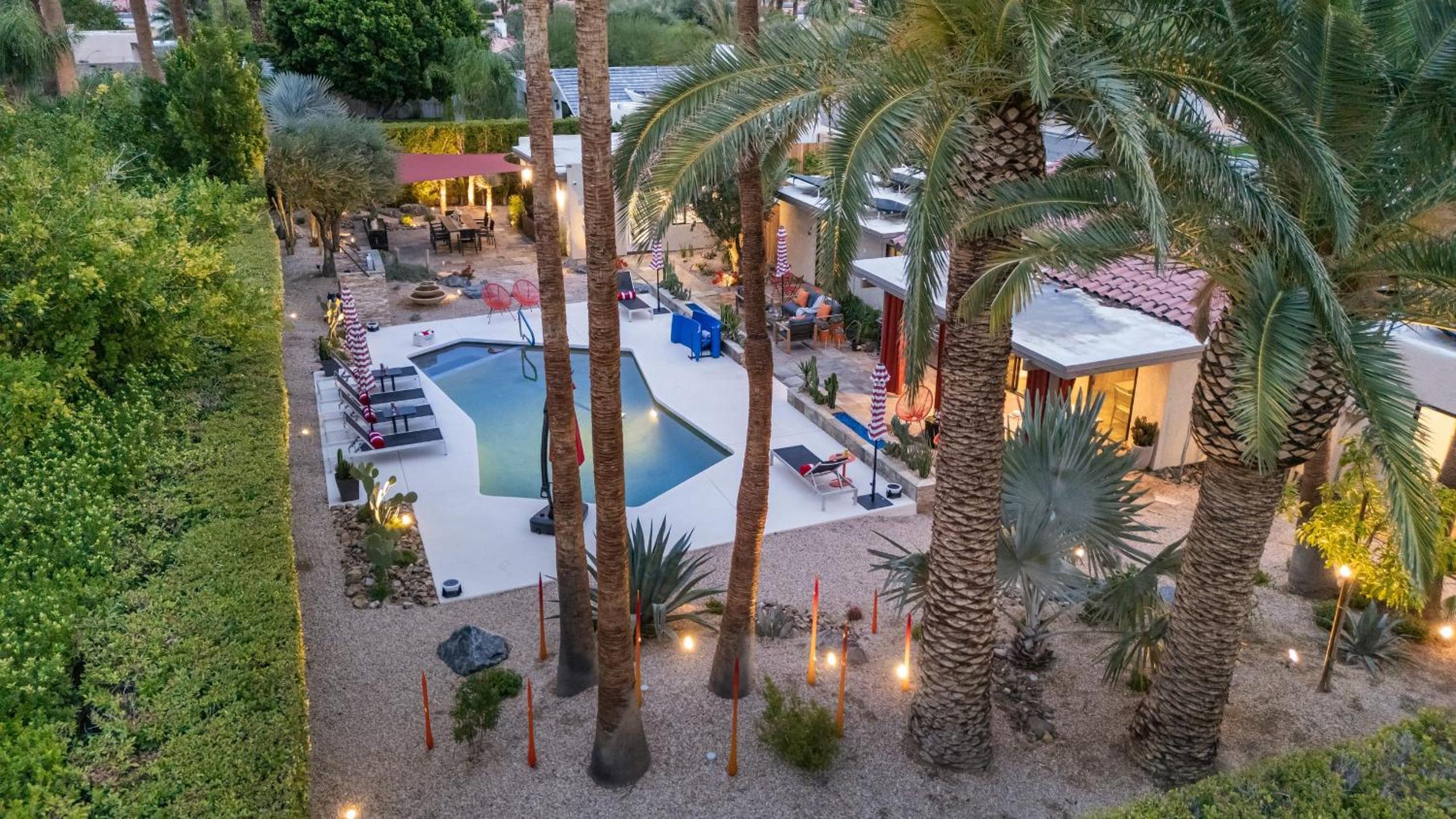 Design-forward Palm Springs home w saltwater pool lush yard multiple outdoor dining areas Casa Papagayo by AvantStay