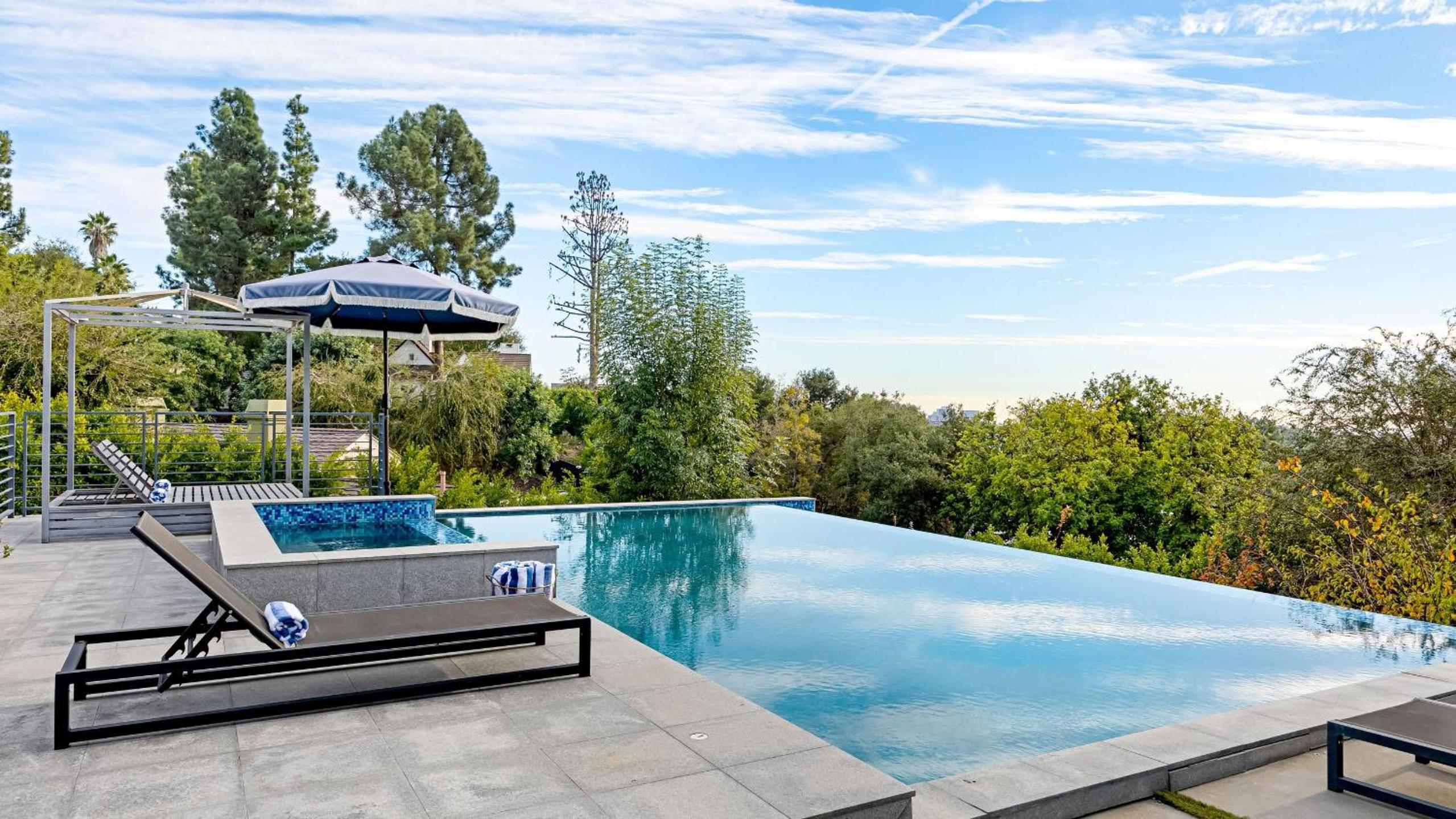 LA Hillside Retreat w Pool Views Fire Pit Outdoor Lounging Casa Bellagio by AvantStay