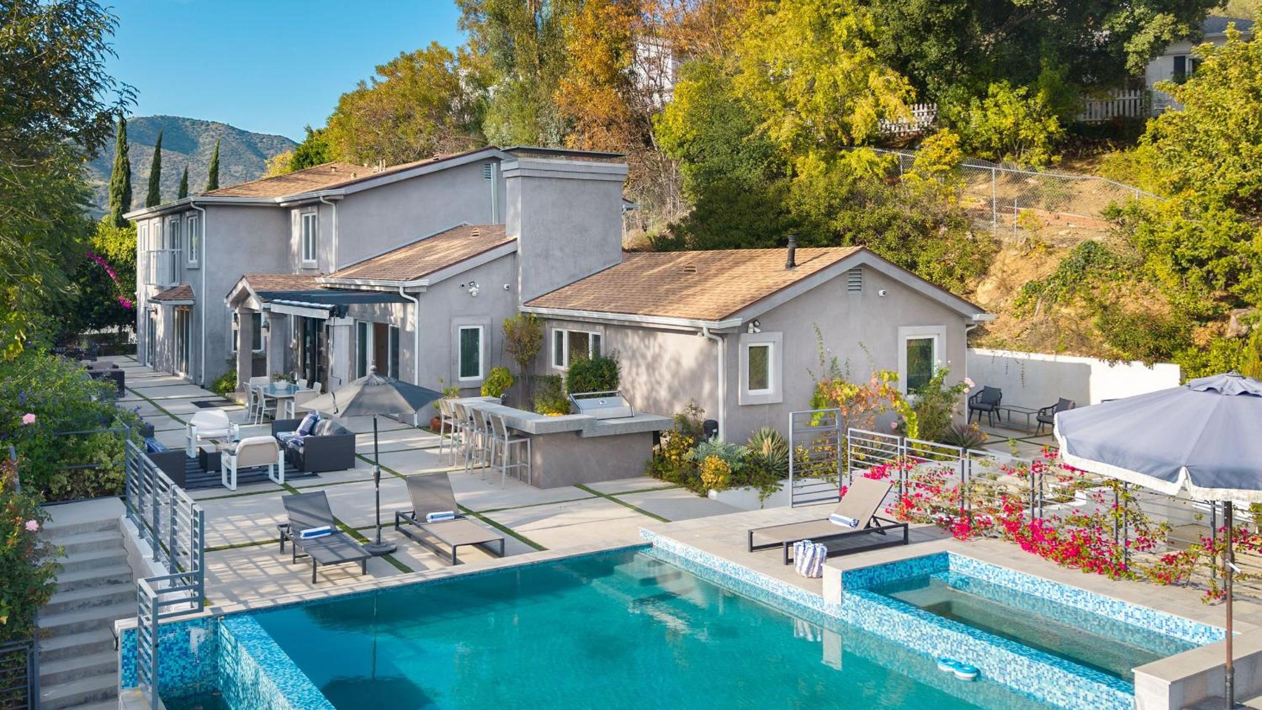 LA Hillside Retreat w Pool Views Fire Pit Outdoor Lounging Casa Bellagio by AvantStay