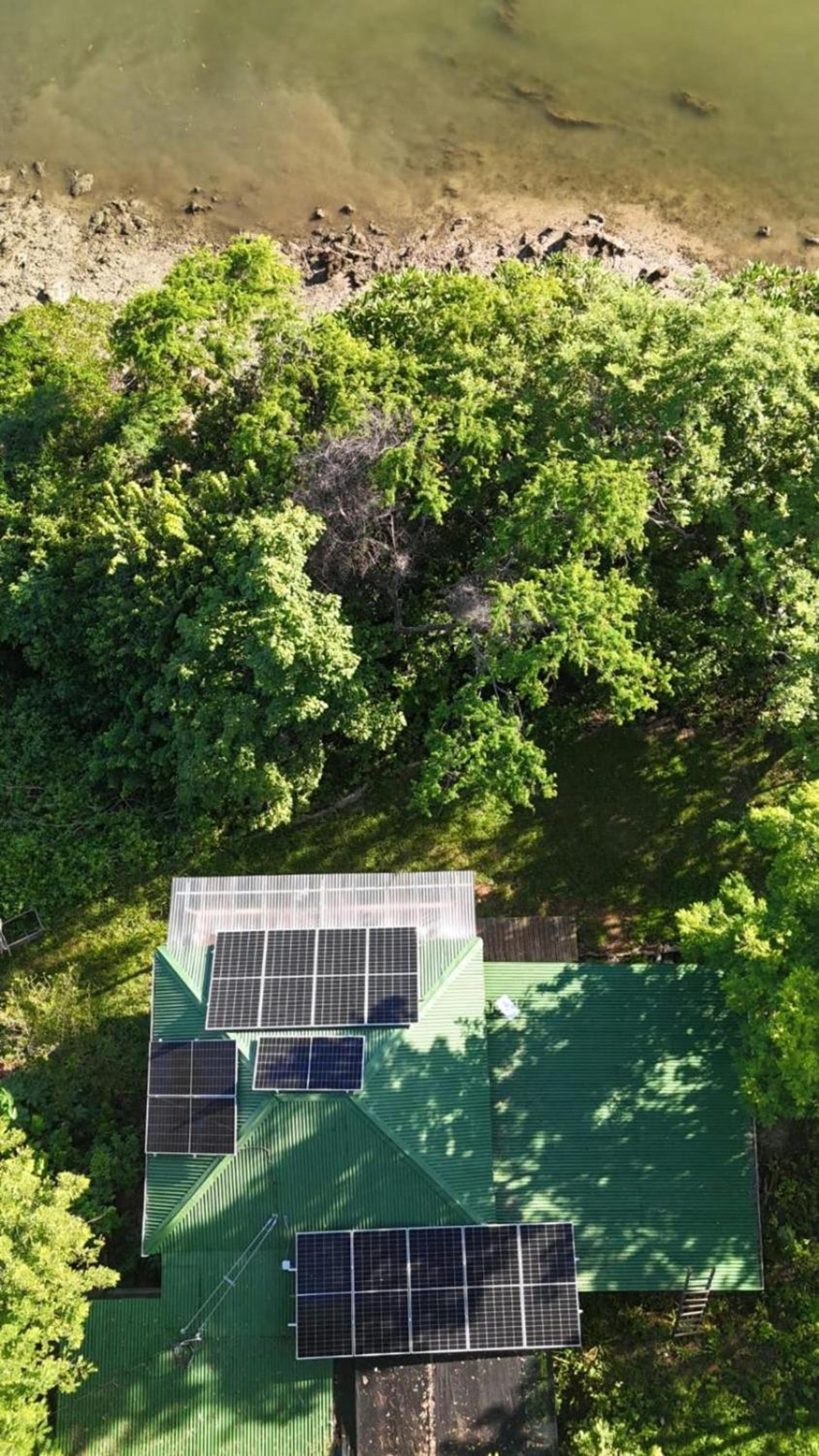Teak house in a forest above the beach