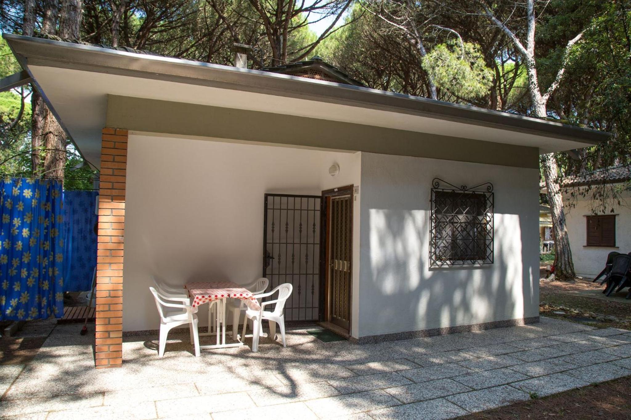 Pine-front bungalow steps from the beach