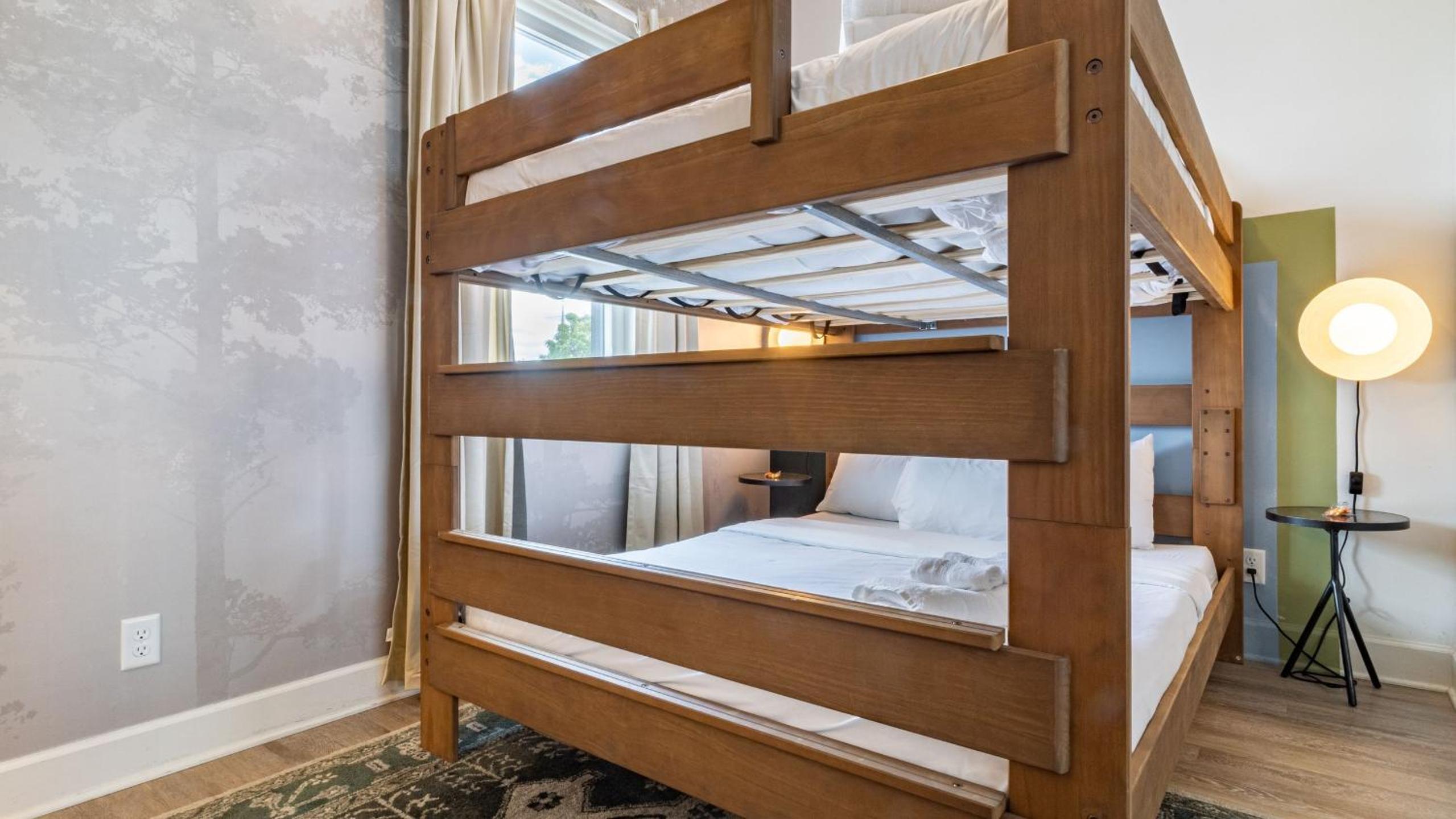 Sleeps 44 4 themed lofts w skyline balconies neon backdrops glam kitchens—perfect for Nashville group stays The Swift Retreat by AvantStay