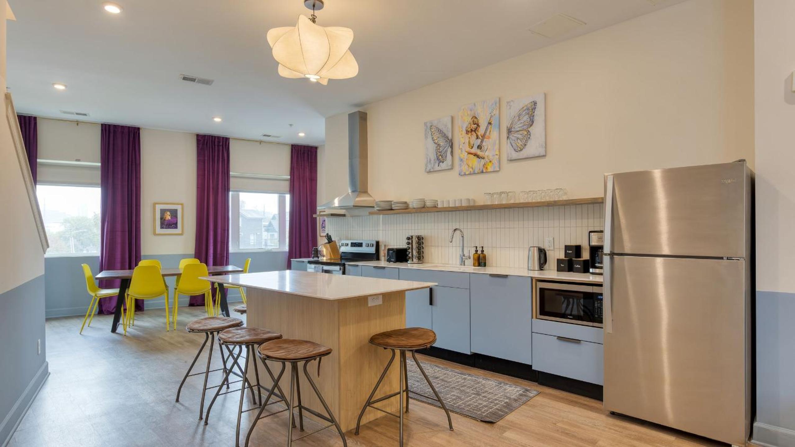 Sleeps 44 4 themed lofts w skyline balconies neon backdrops glam kitchens—perfect for Nashville group stays The Swift Retreat by AvantStay